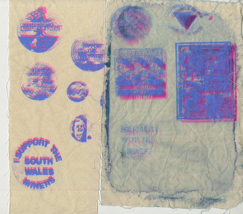 Screen printed badges from the LGSM campaign.