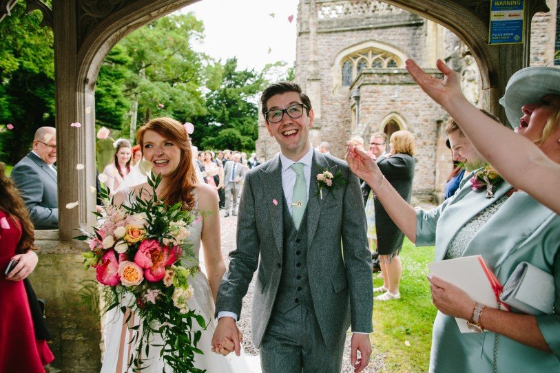 Wedding florist creating summer bouquet at Coombe Lodge