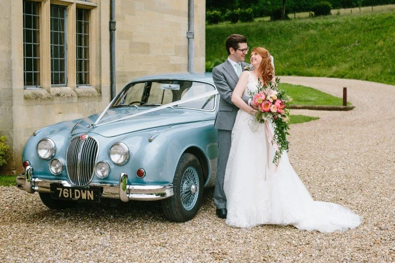 Coombe Lodge wedding ceremony arch with summer floral arrangements