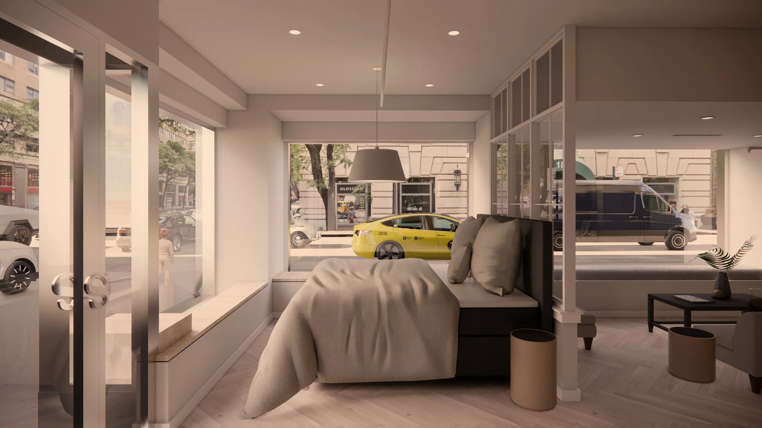 Interior of a modern hotel room with a bed, large windows facing the city street with cars and trees, and a nightstand with a vase. Outside, a yellow taxi and black van are parked on the street.