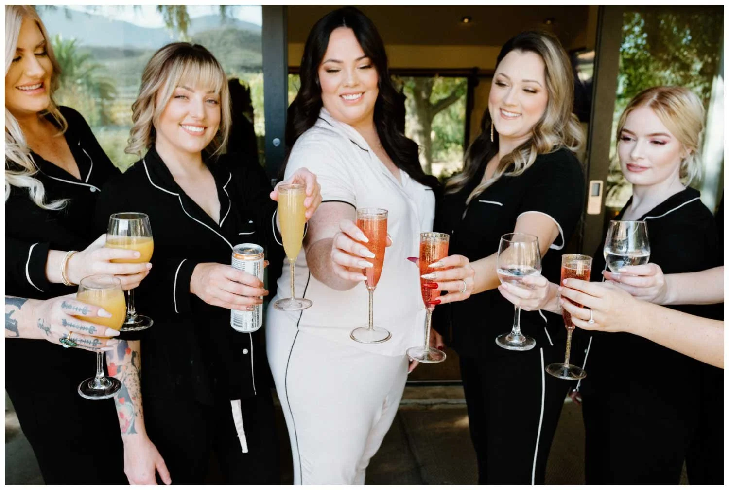 Bride and Bridesmaids getting ready champagne toast