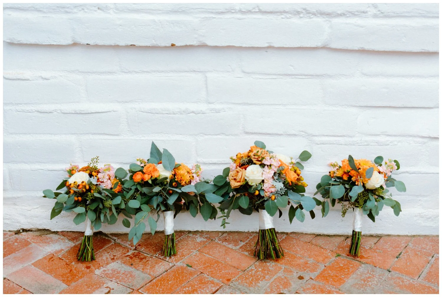 fall colored bridal and bridesmaids bouquets in the old rancho estate, candid and editorial wedding photography in carlsbad, ca