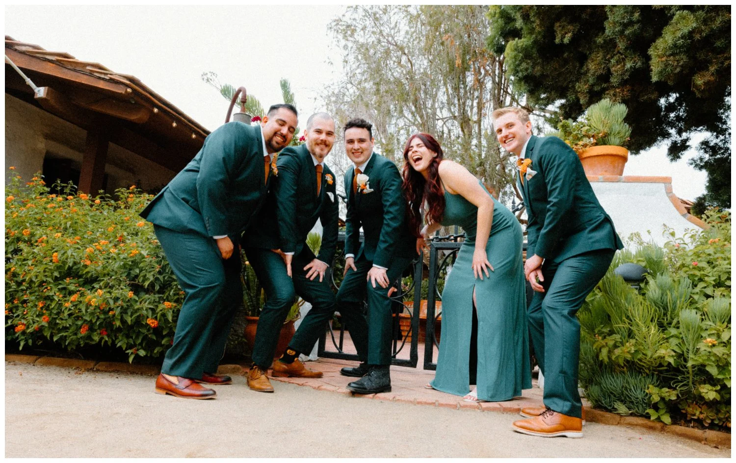 co-ed pop group photo of the groom and his wedding party in emerald green colors, the old rancho estate in carlsbad san diego usa