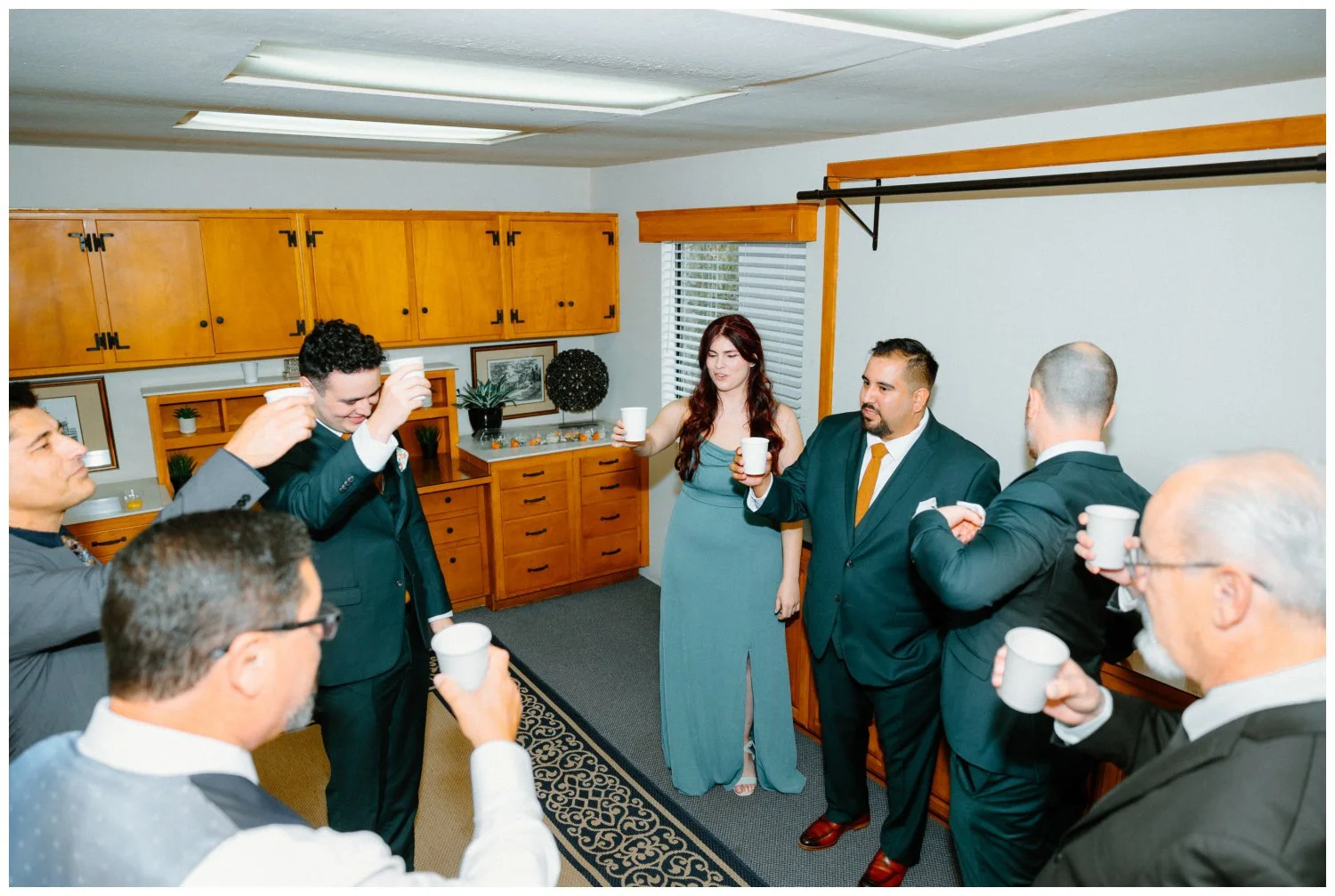 groom and his groomspeople cheers