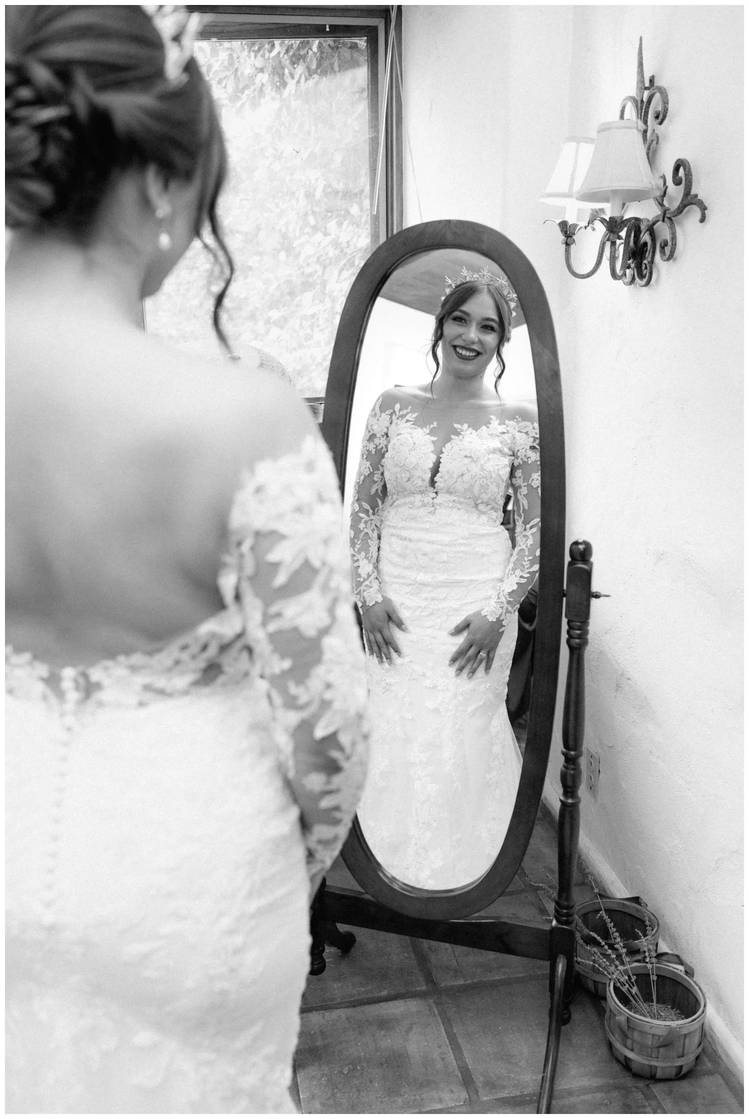 bride looks at her reflection as she finishes getting ready, cinematic wedding photography in the old rancho carlsbad, california usa
