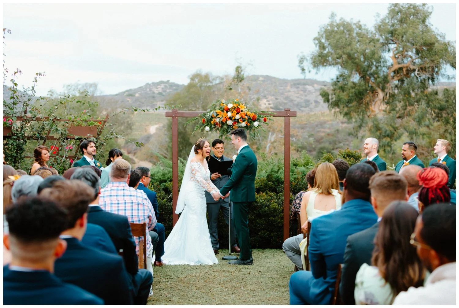 wide shot of bride and groom at ceremony