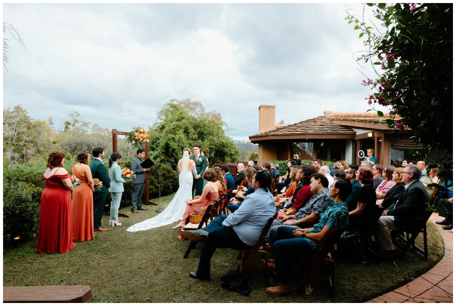 wide angle corner shot of the whole ceremony at the old rancho estate wedding venue in carlsbad, ca