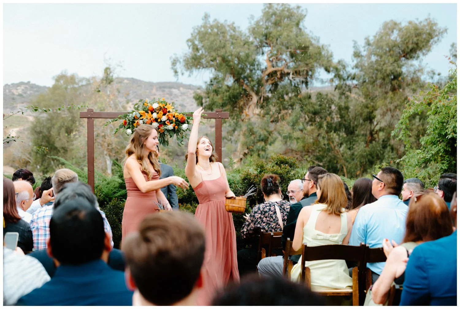 flower ladies toss lavender petals down the aisle