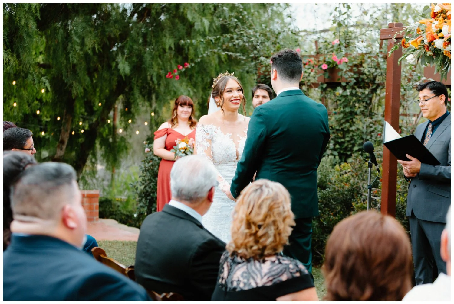 bride smiles at groom during ceremony vows