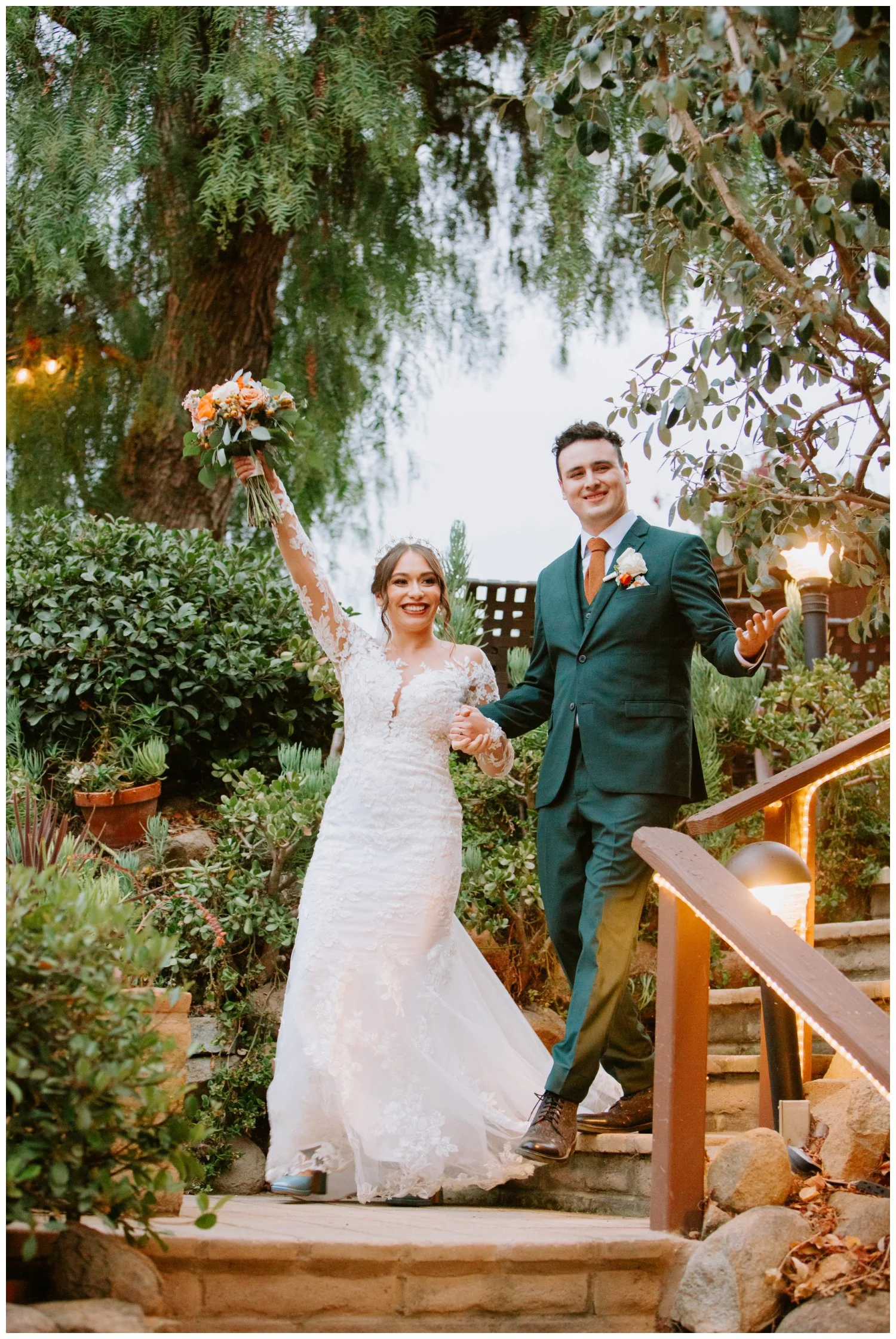 Bride and Groom dancing grand entrance, rainy boho chic reception photos at the old rancho estate carlsbad, california, usa