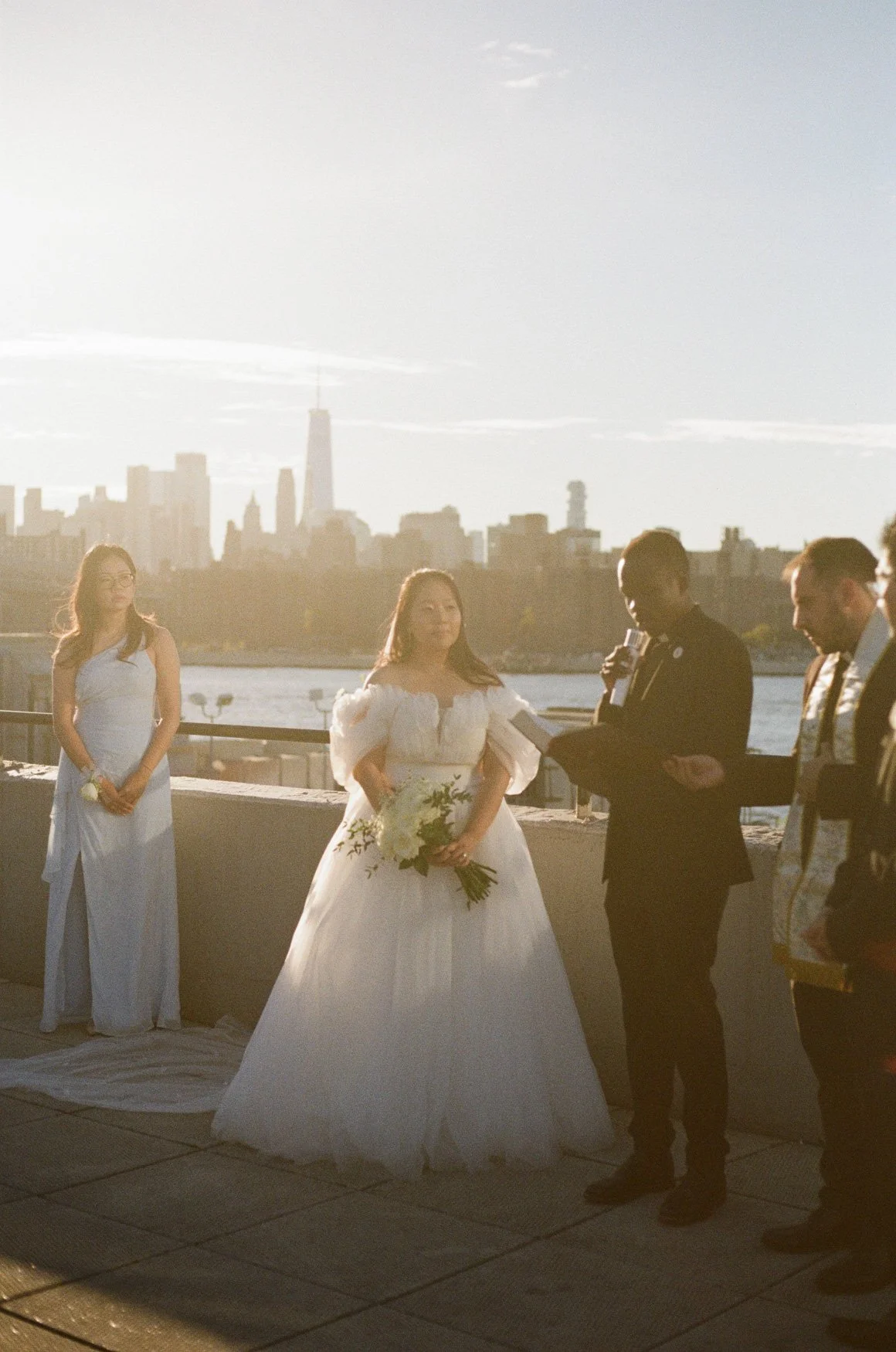 rooftop wedding in 35mm film, with the manhattan skyline