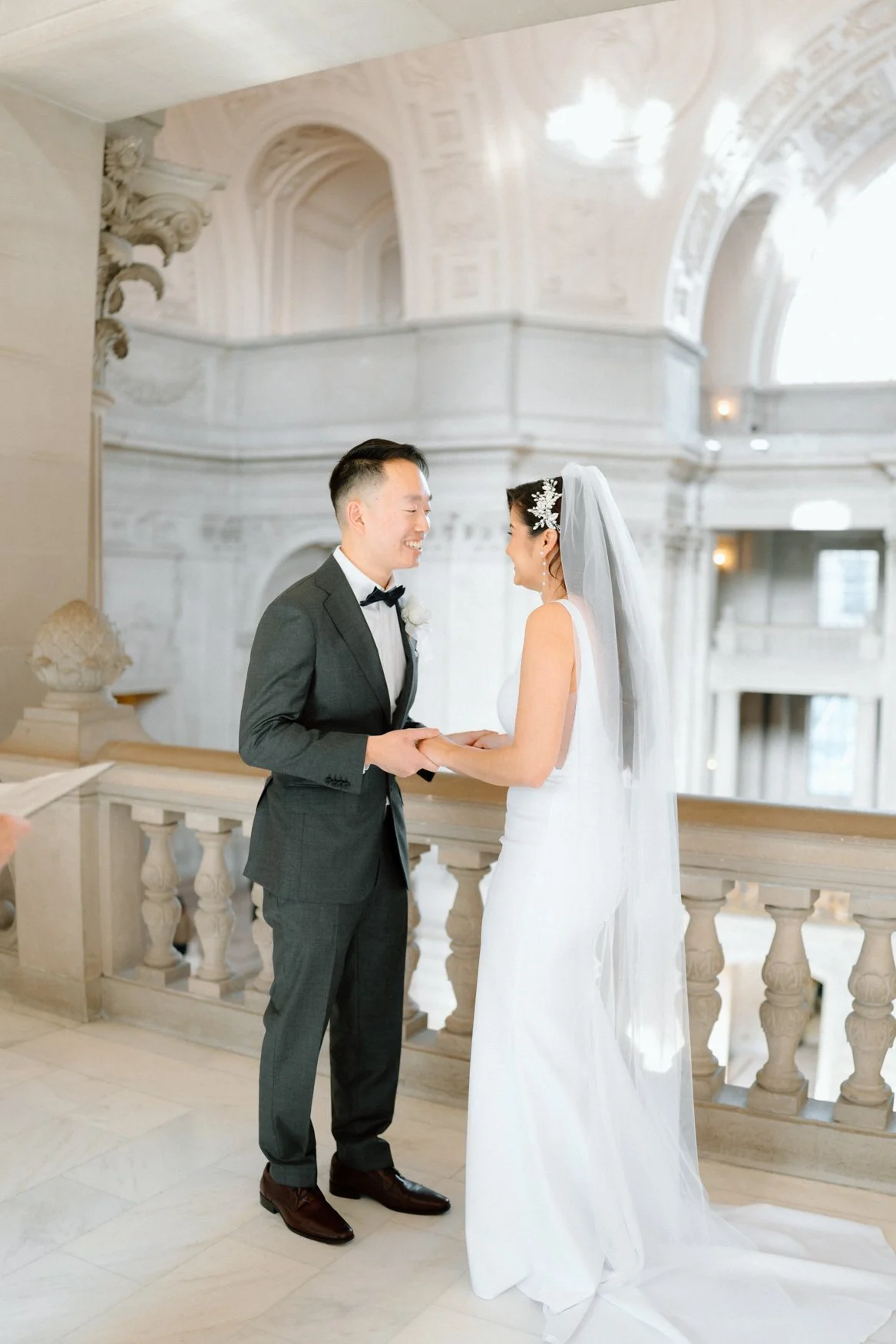Jonathan and Carla giddy holding hands after being officially called husband and wife