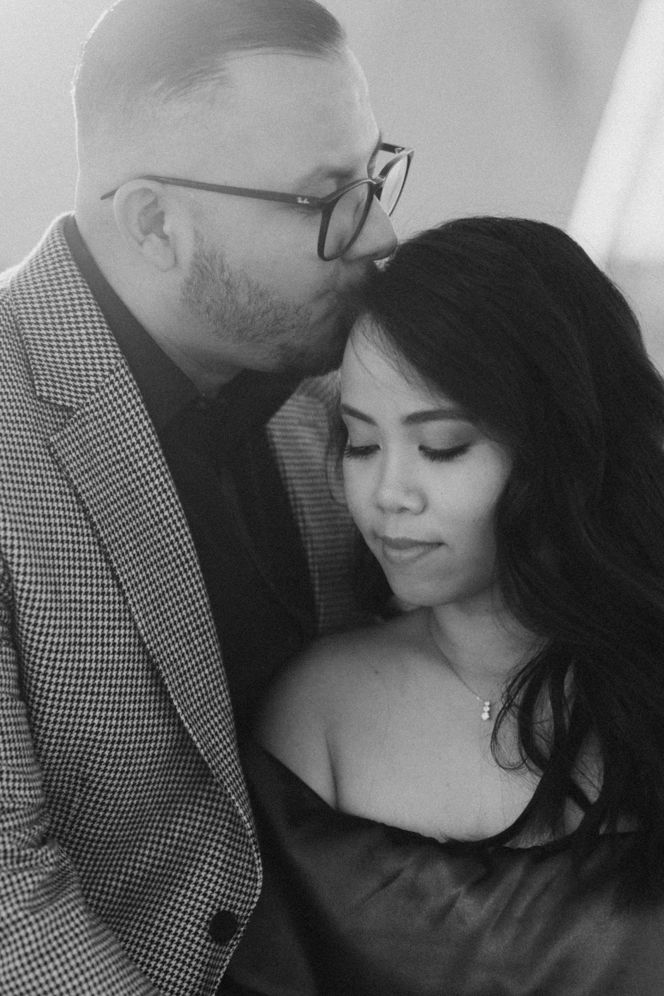 black and white closeup photo of katherine and ricardo in downtown los angeles. romantic film engagement photographer by evening photography