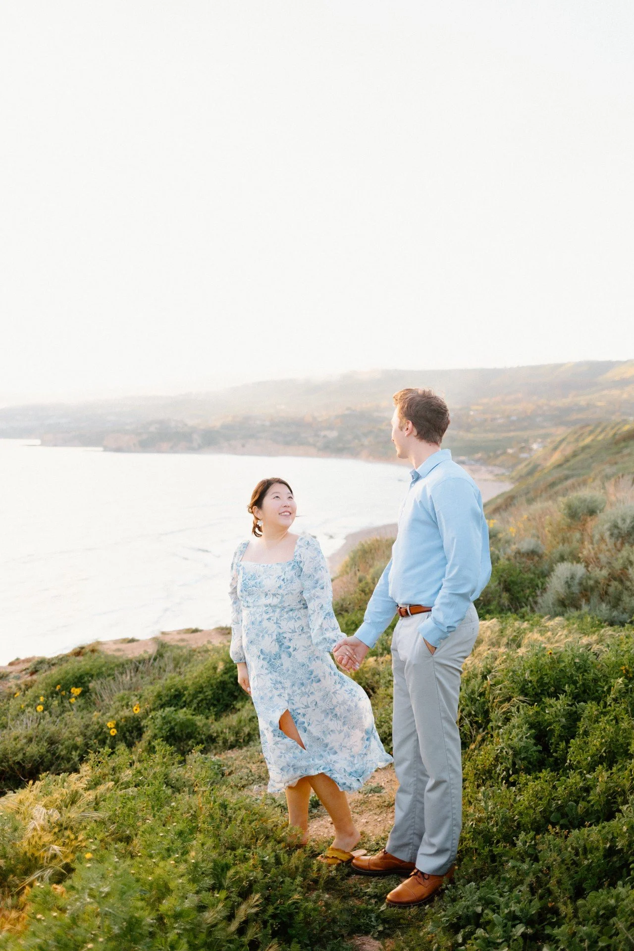 couple on a cliff overlooking the ocean, palos verdes, ca