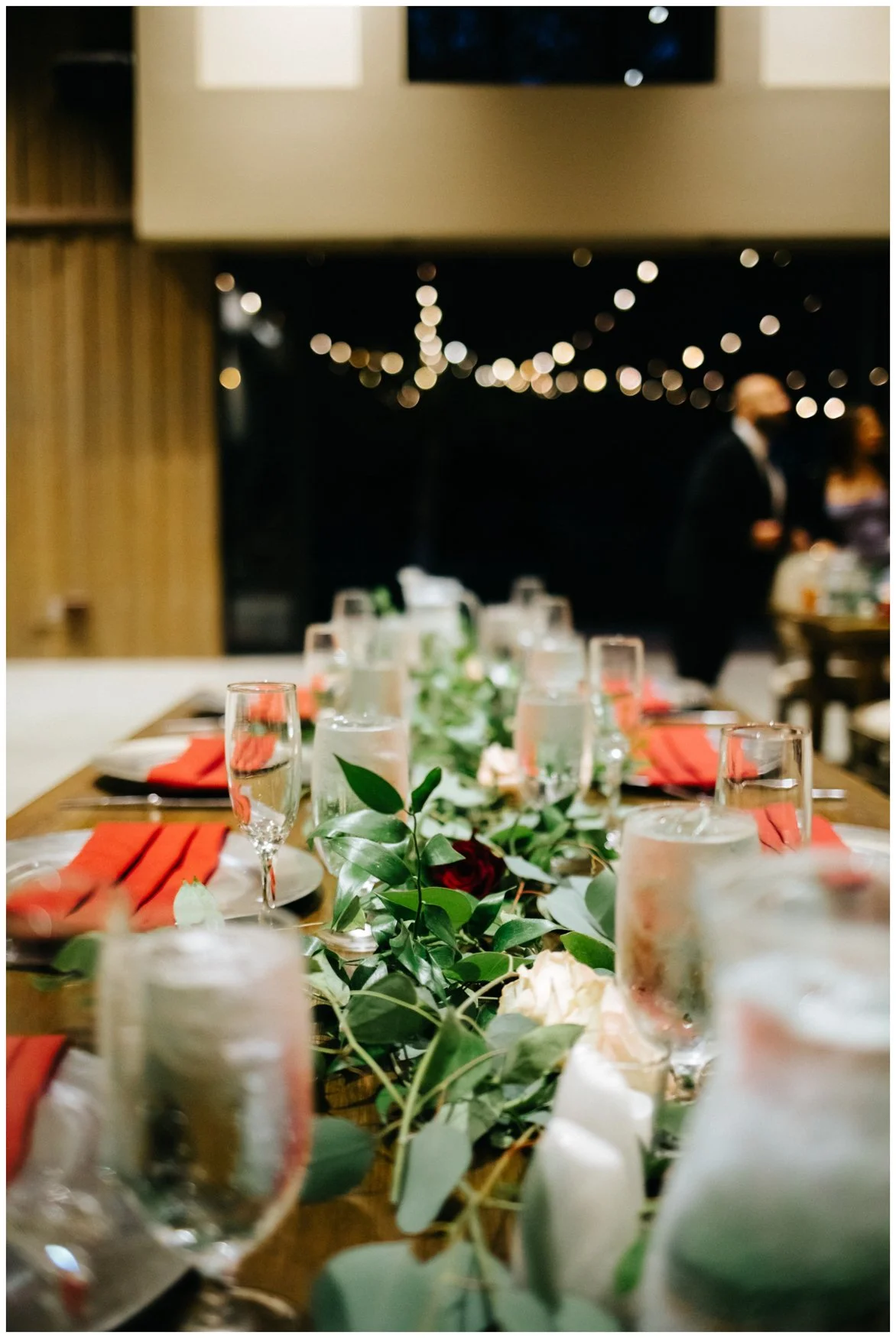 Galway Downs Wedding reception long tablescape with eucalyptus runner and fairy lights.