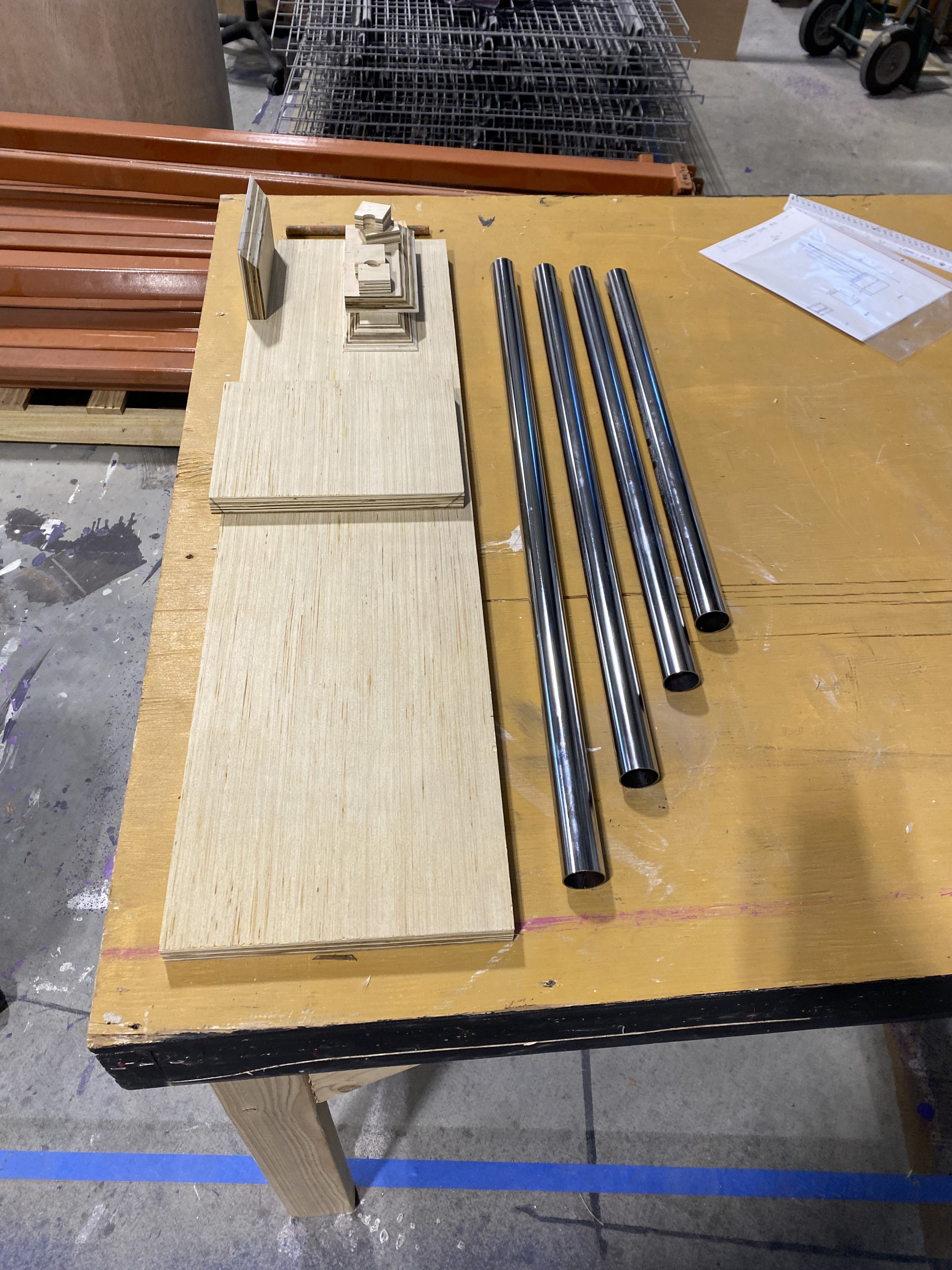 I laminated plywood with luan to create a better texture for the chimes. From there I made a cut list and proceeded to cut all of the pieces I needed for my chime box. For the chimes themselves I cut down shower curtain rods on the gravity feed bands
