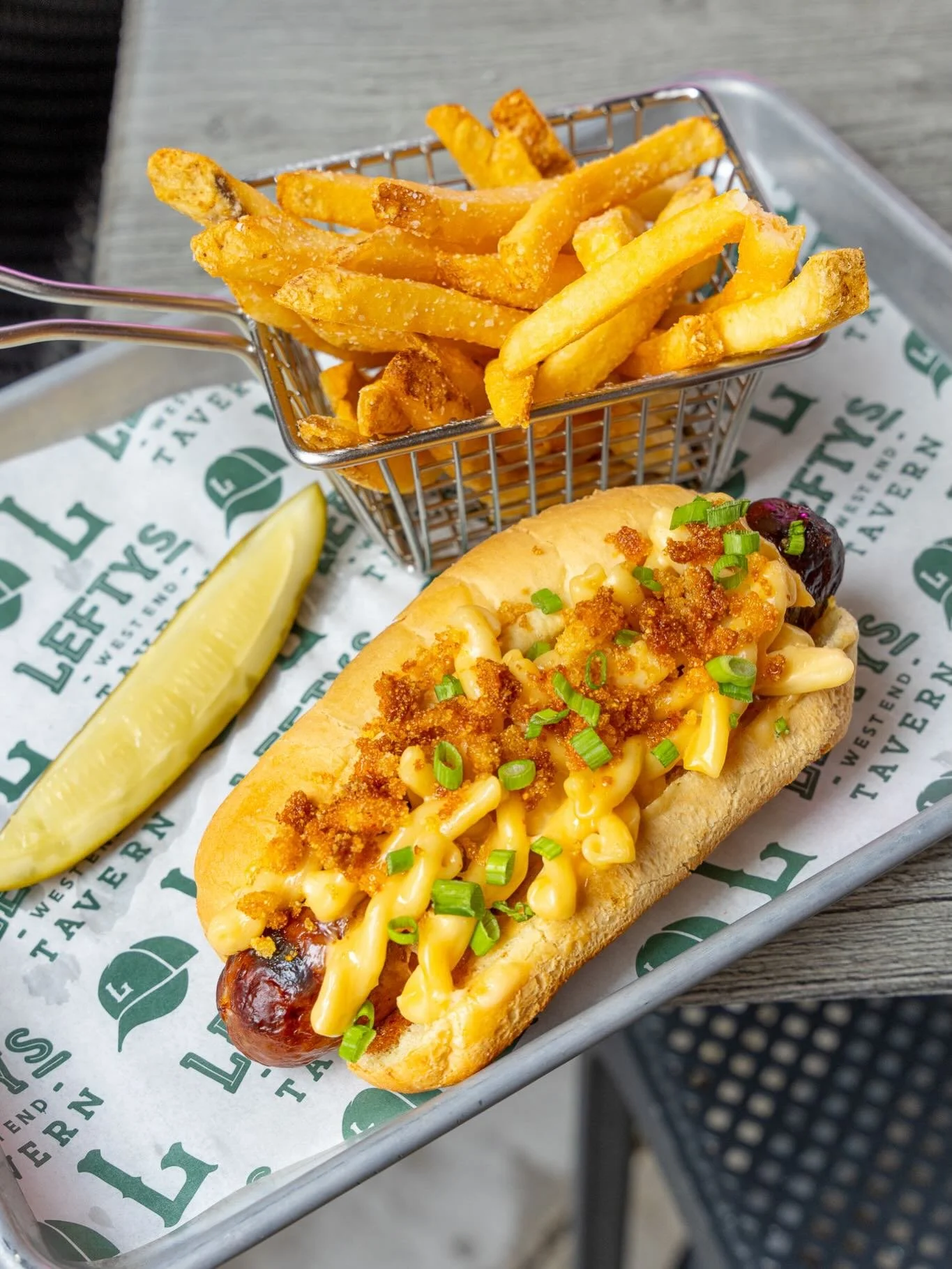 Meet the MAC &amp; Jack 🌭🔥 Jalape&ntilde;o cheddar dog stacked with mac &amp; cheese, cornbread crumble, hot honey, and green onions. Available all April at Lefty&rsquo;s!
