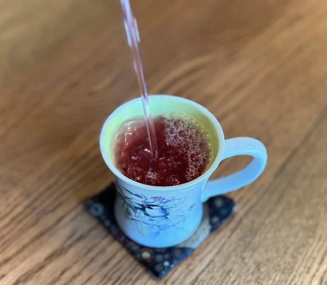 Elderberry tea pouring.jpg