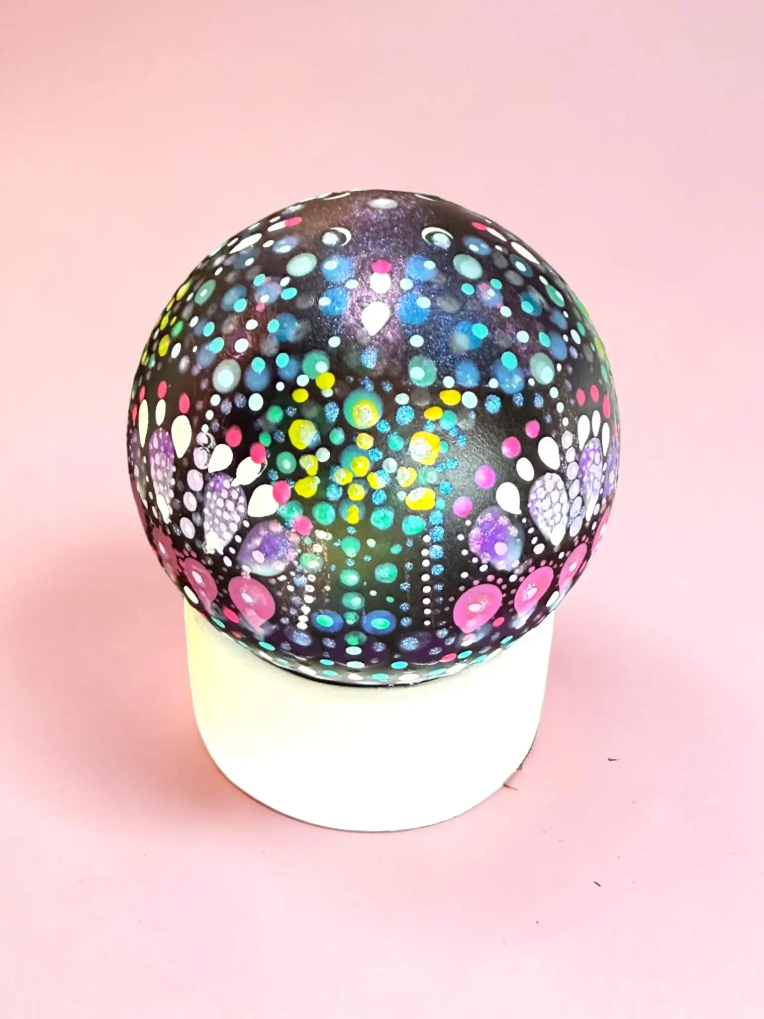 Large Pedestal Globe featuring a white pedestal and a black globe with colorful dot mandala artwork that glows in the dark.