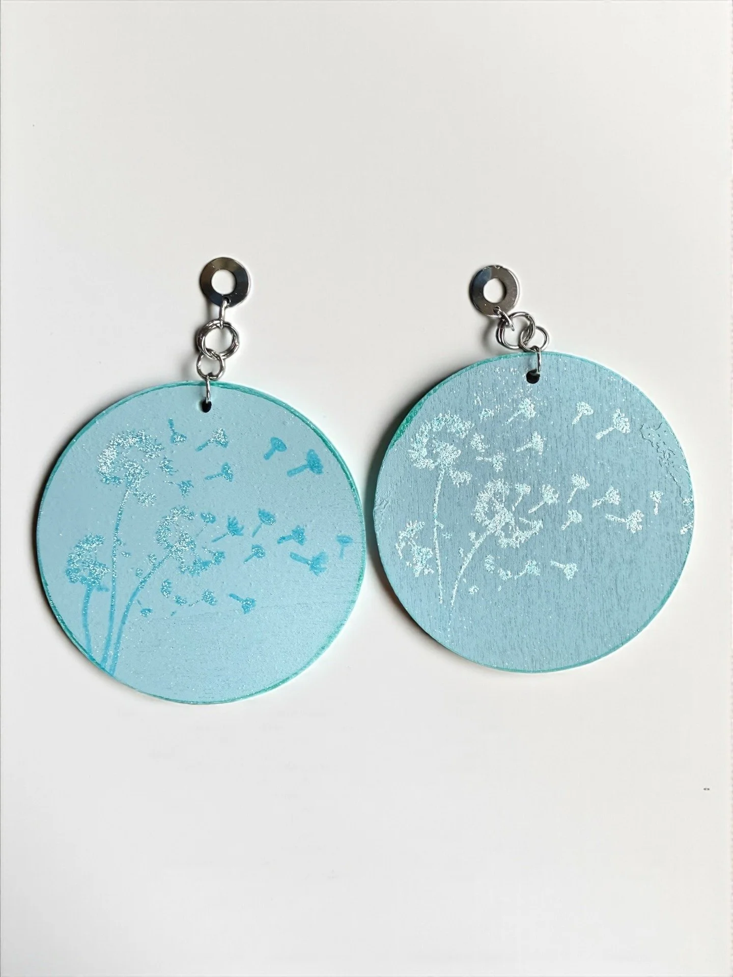 Color Cult's Queen Earring Collection boasts lightweight design despite each hand-painted wooden earring being 3-inches wide.

See our whole collection today! www.colorcult.live/jewelry-boutique/earrings