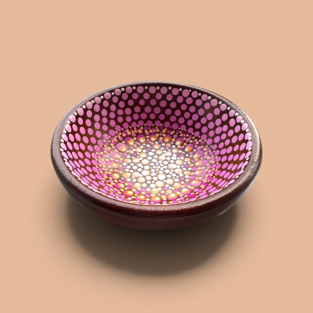 Handmadet trinket dish with ornate artwork.