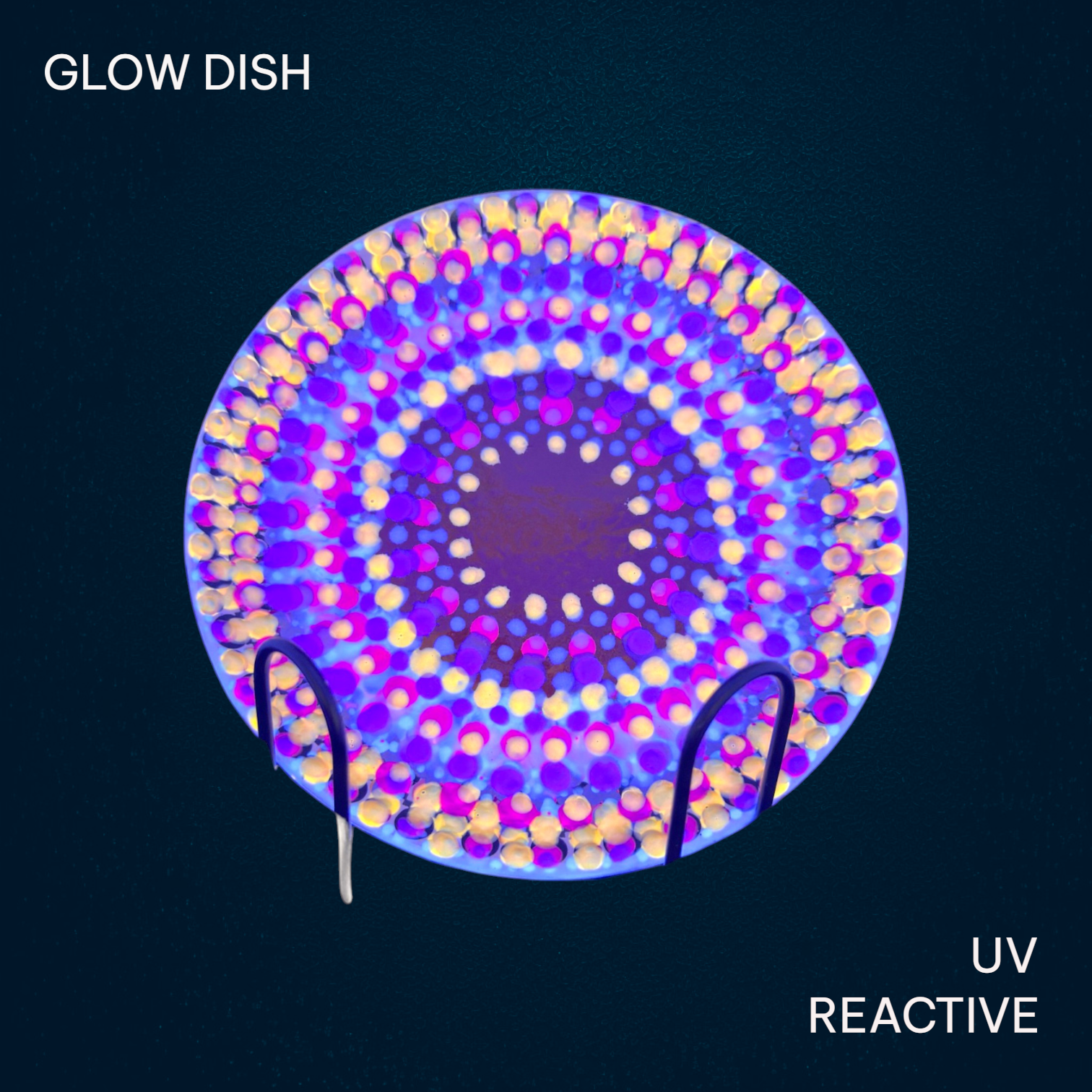 Colorful decorative glass plates on a dark table with grooved and patterned designs.