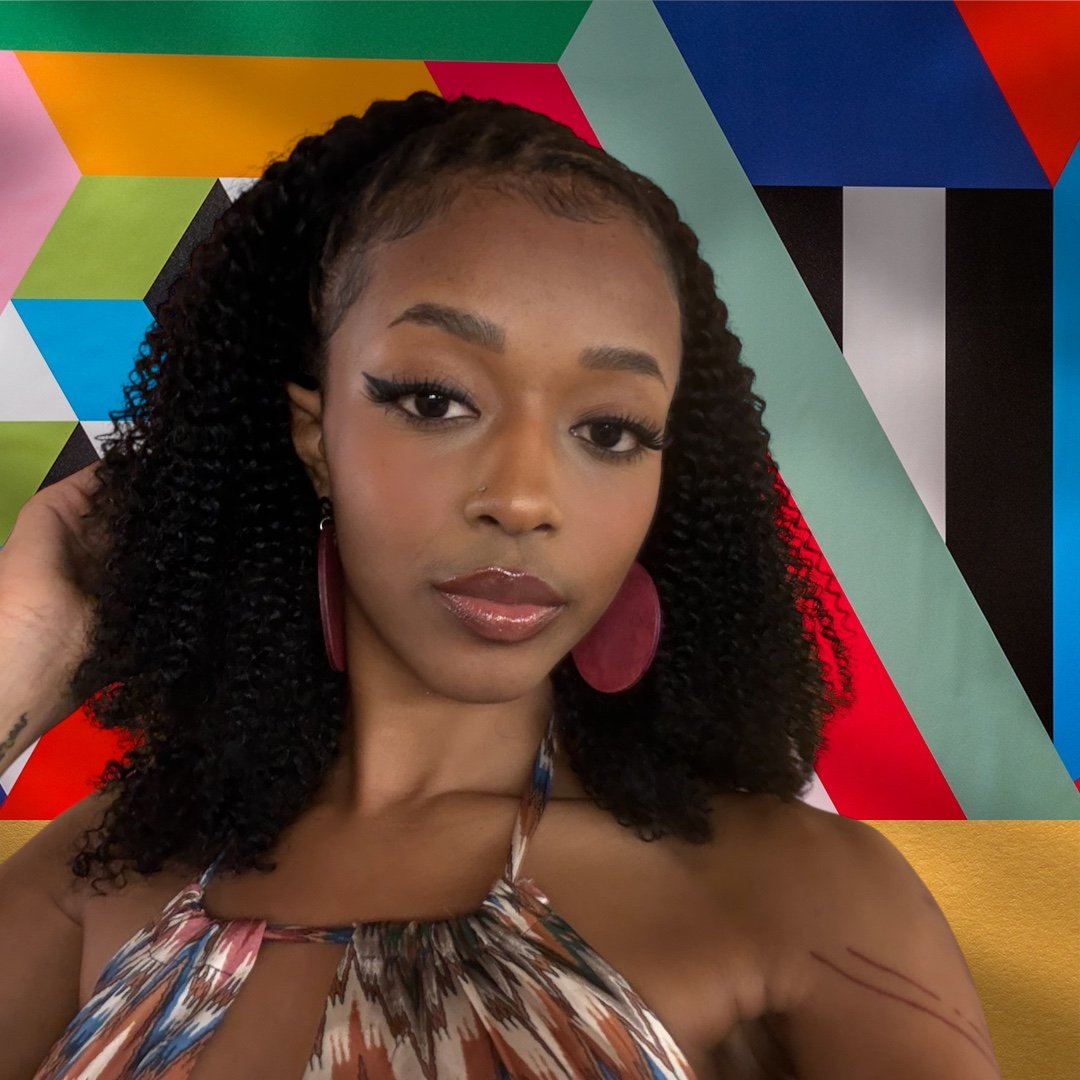 Model wearing red earrings made by Color Cult Design Studio