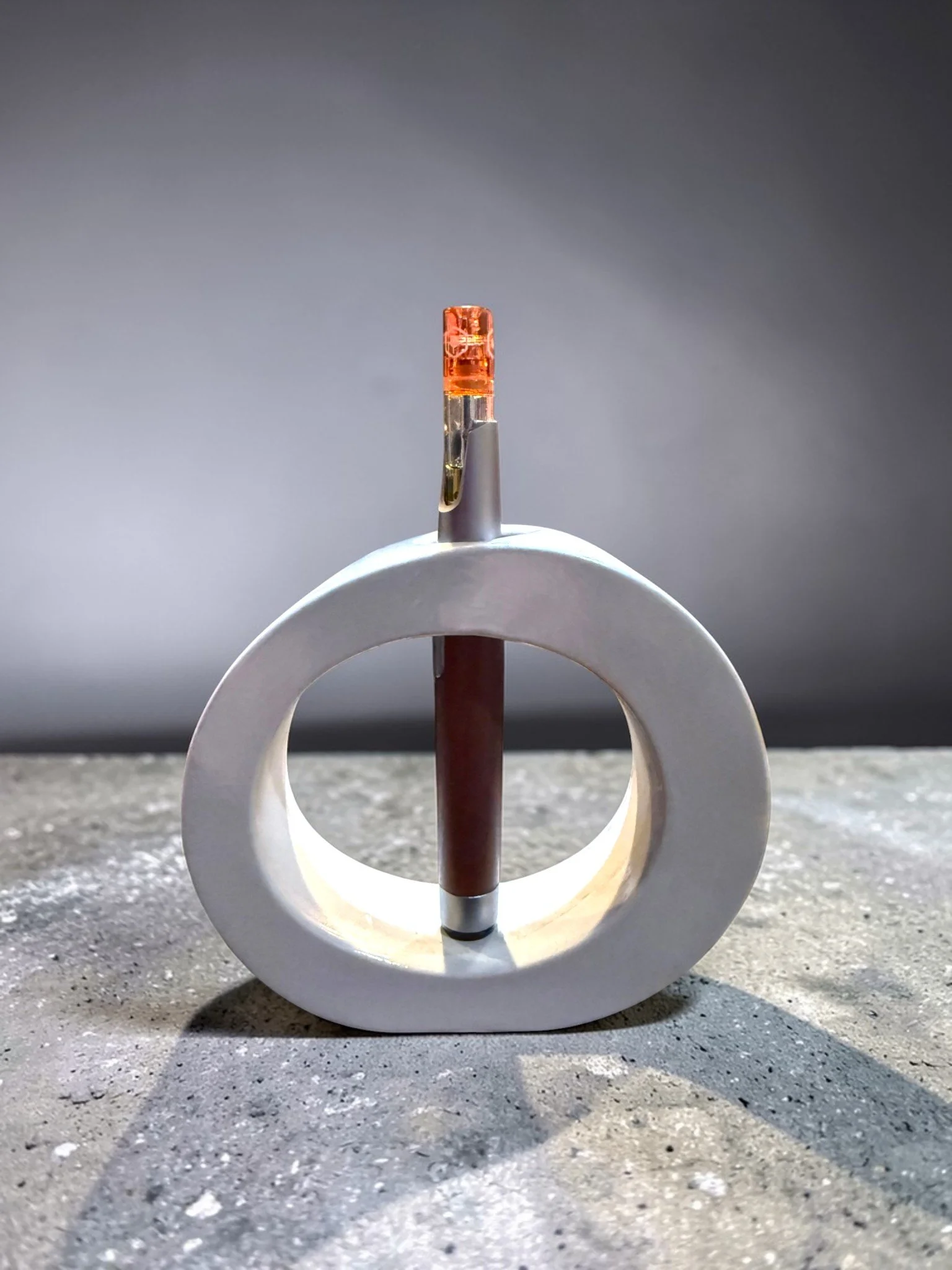 Sleek Cement Display Stand For a Vape Pen