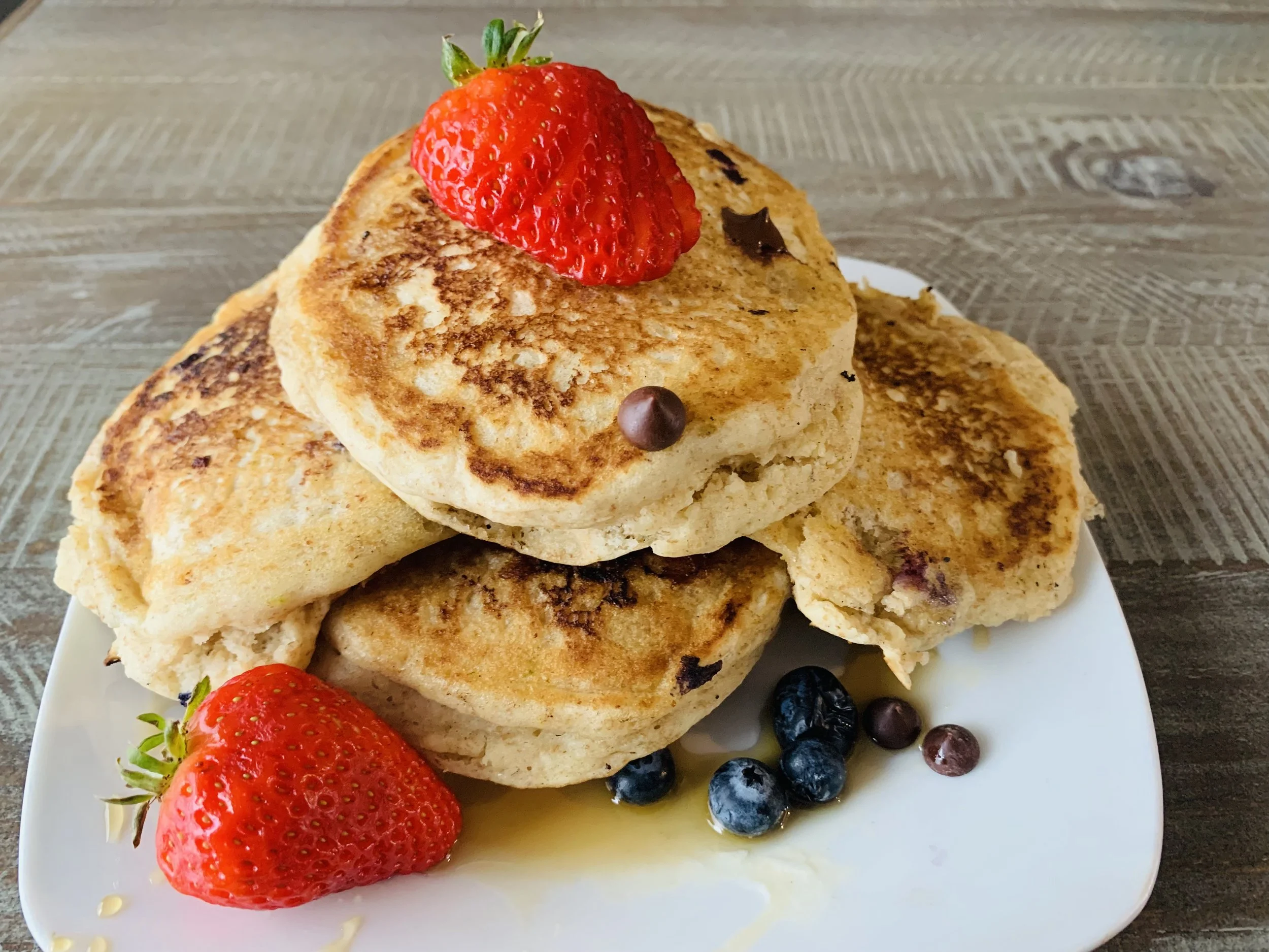 Stack of 4 Fluffy Pancakes - House-made berry sauce & Maple Syrup