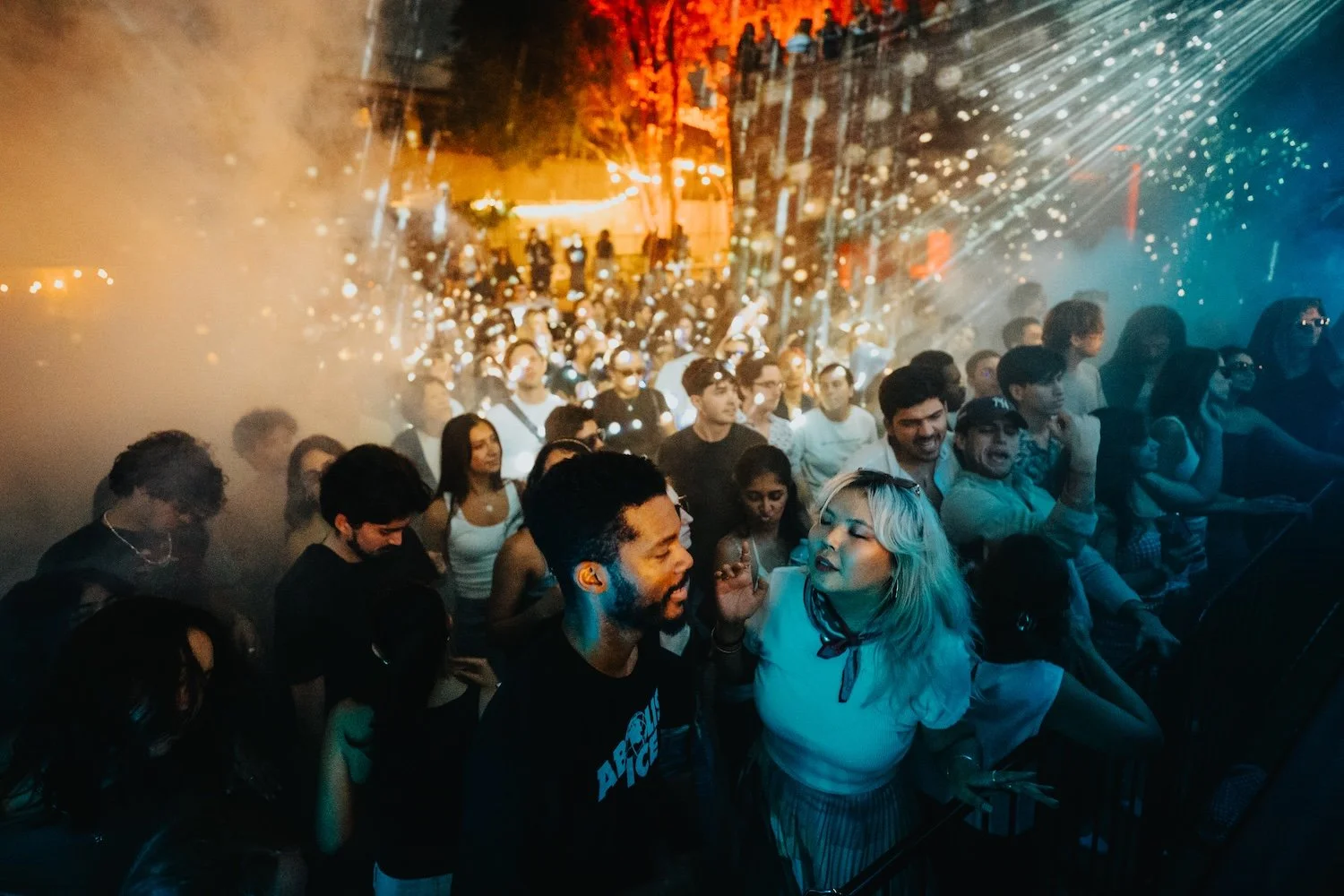 Two fans engaging at the front of the crowd 