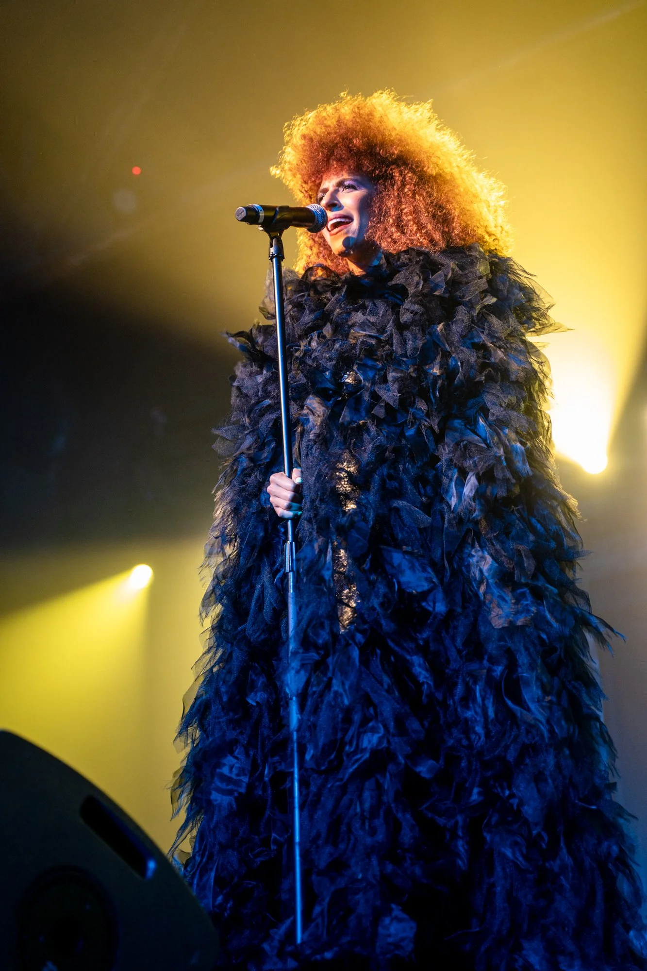  Woman with curly hair singing 