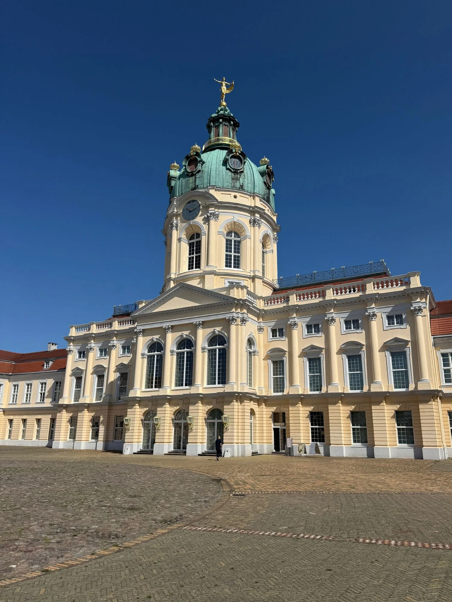 Baroque facade, courtyard, and central dome of Charlottenburg Palace in Berlin