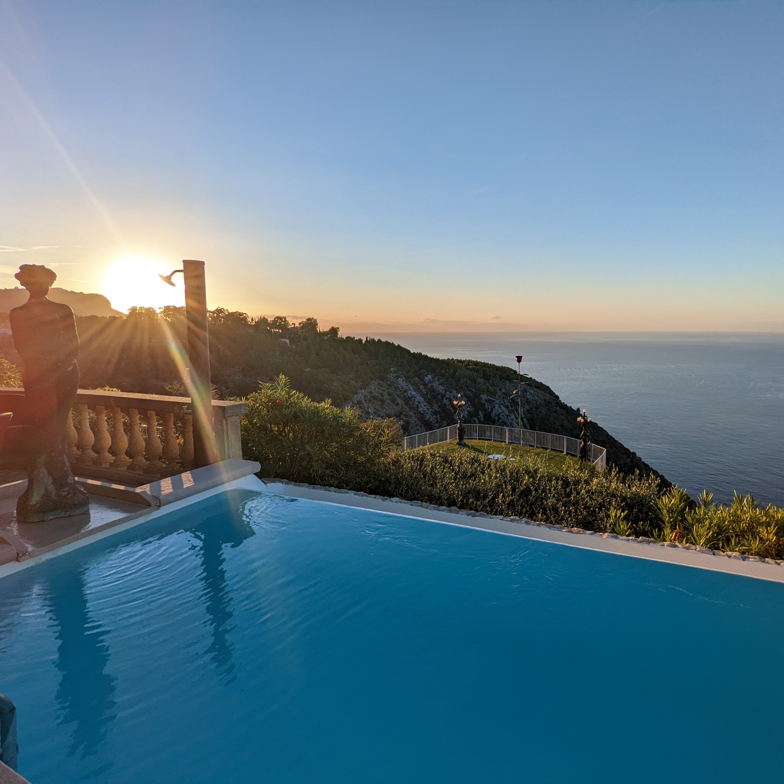 Sunset over the Infinity Pool in the Panoramic suite Chèvre D'Or.png