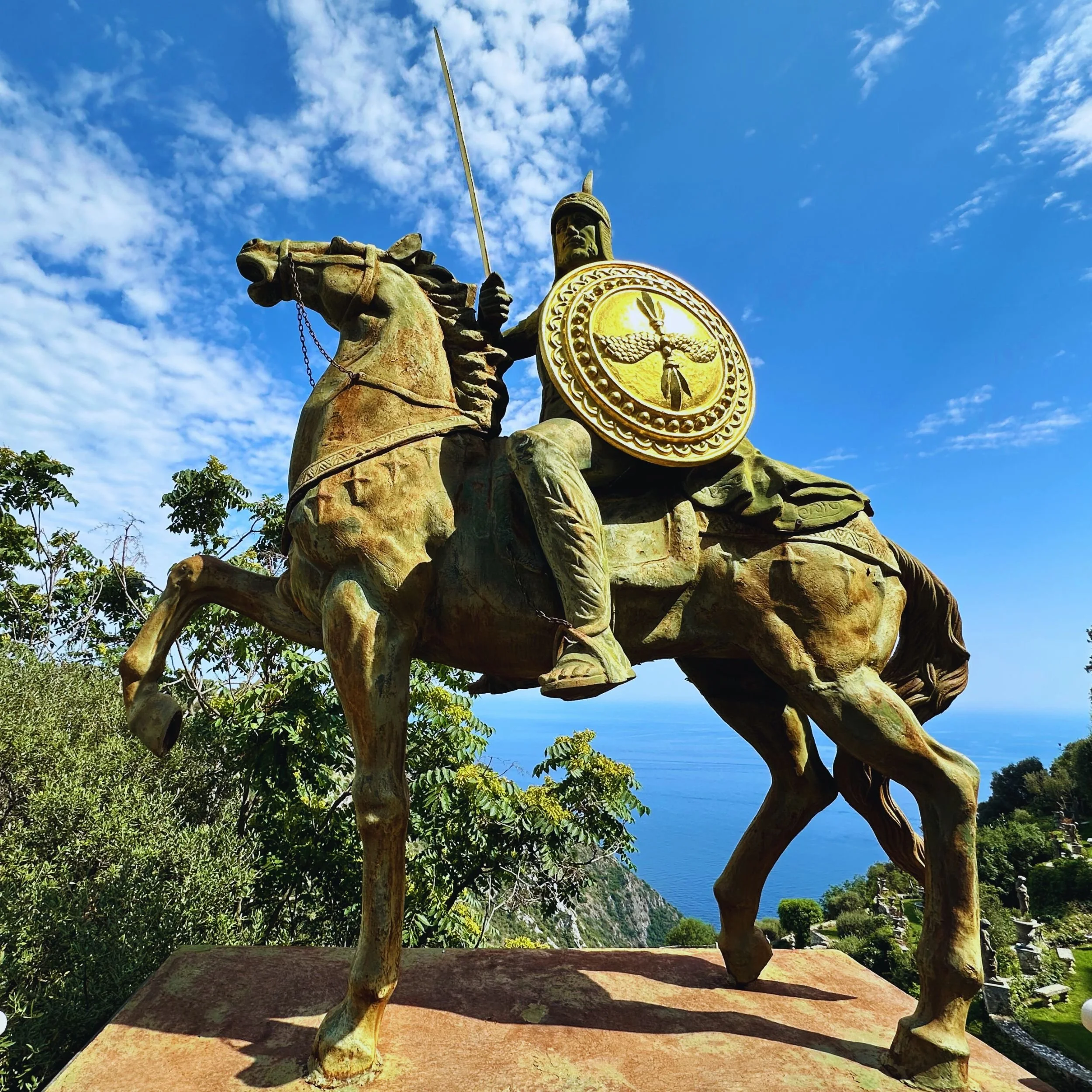iconic golden statue at the entrance to Château de la Chèvre d’Or hotel grounds in Èze