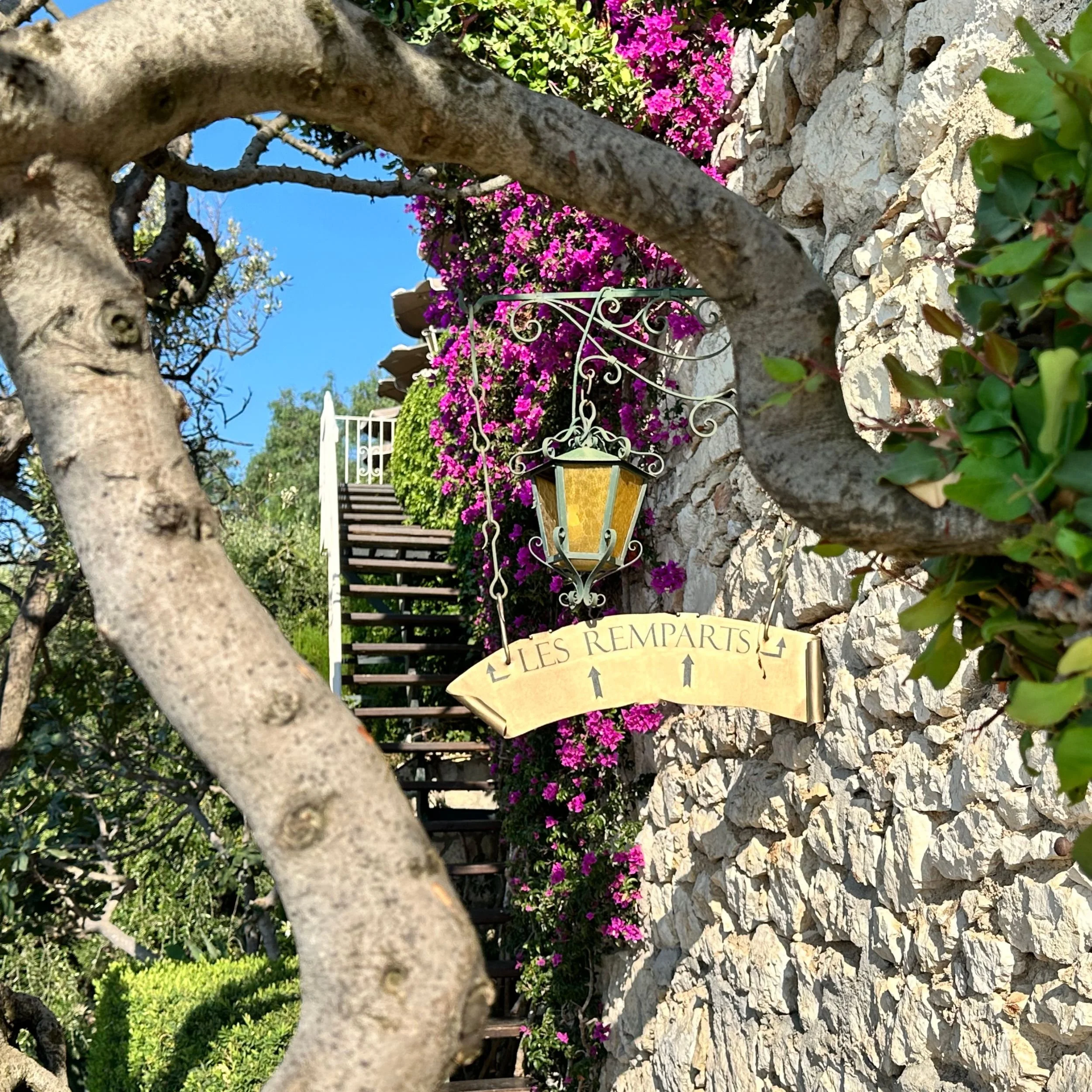 stairs leading up to Les Remparts restaurant at Château de la Chèvre d’Or in Èze