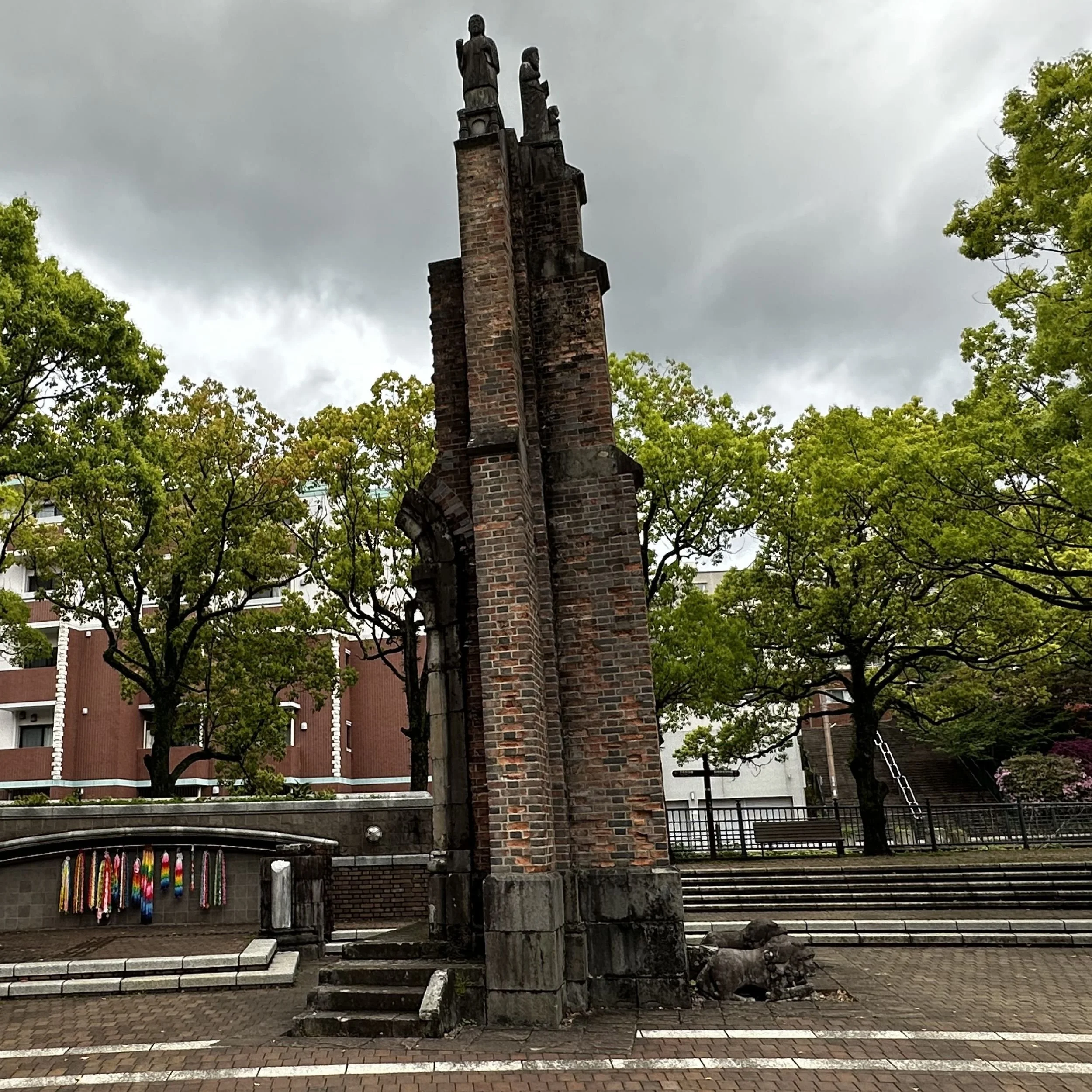 Damaged bell tower and statues of Urakami Cathedral Nagasaki preserved after the atomic bomb explosion near the hypocentre