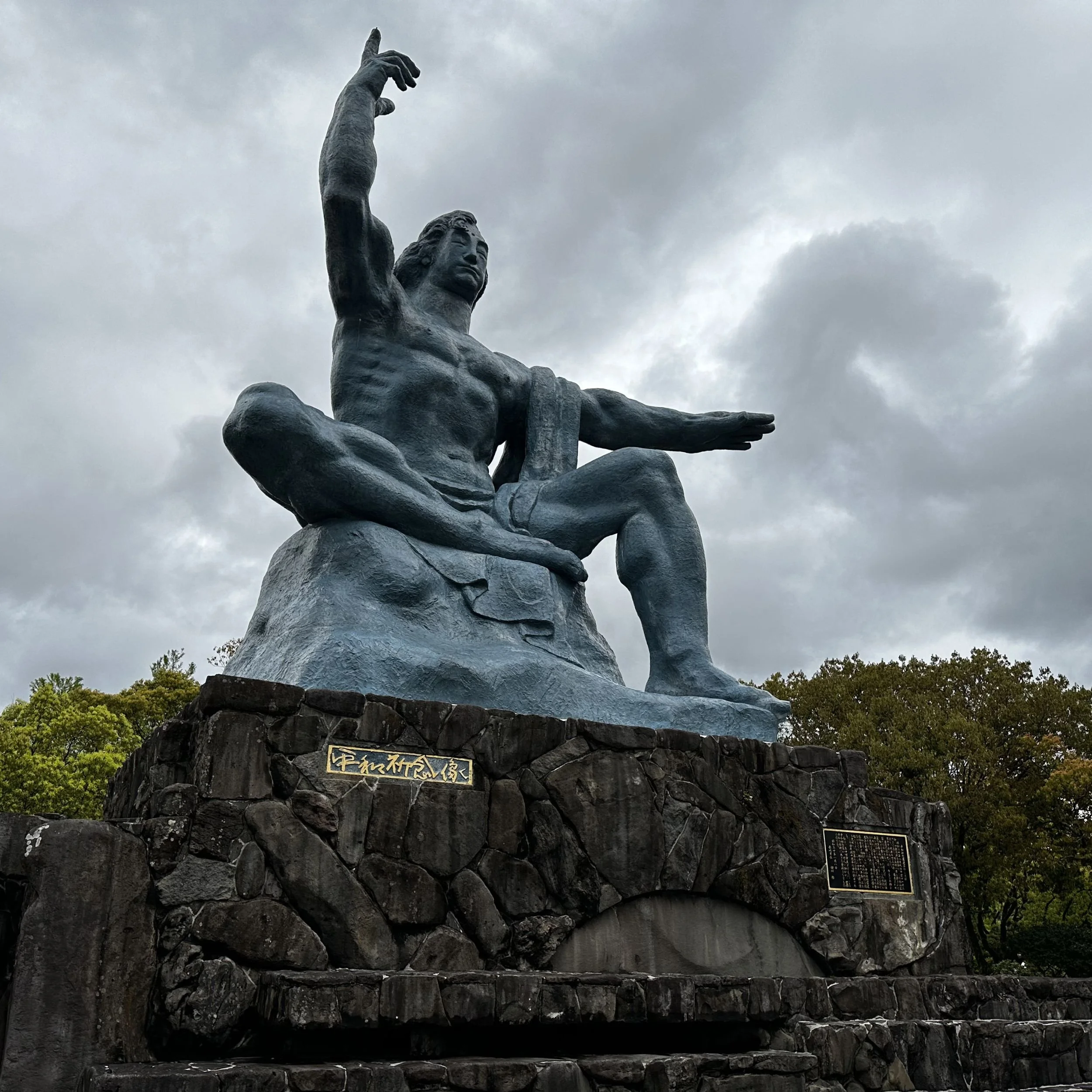 Peace Statue in Nagasaki Peace Park pointing skyward to mark the direction of the atomic explosion in 1945