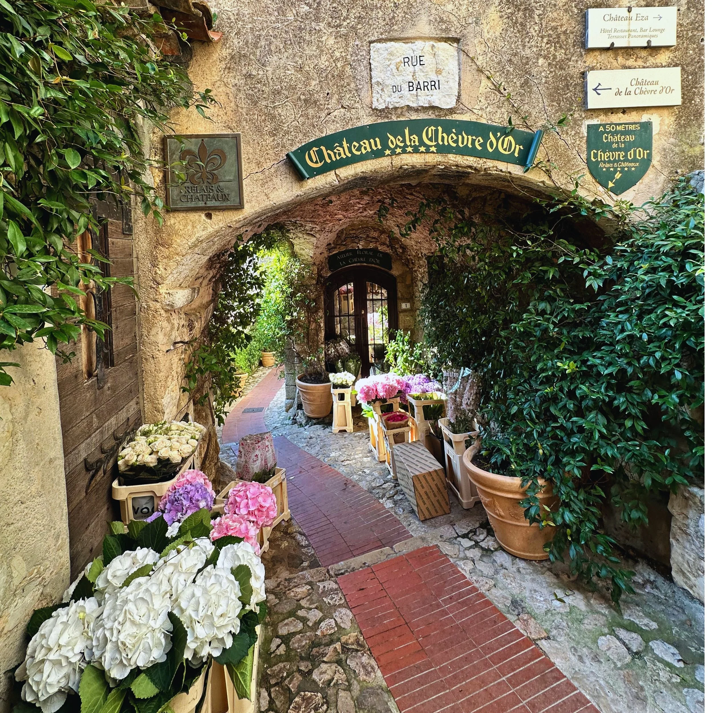 Early morning flower delivery on a quiet street in Èze village