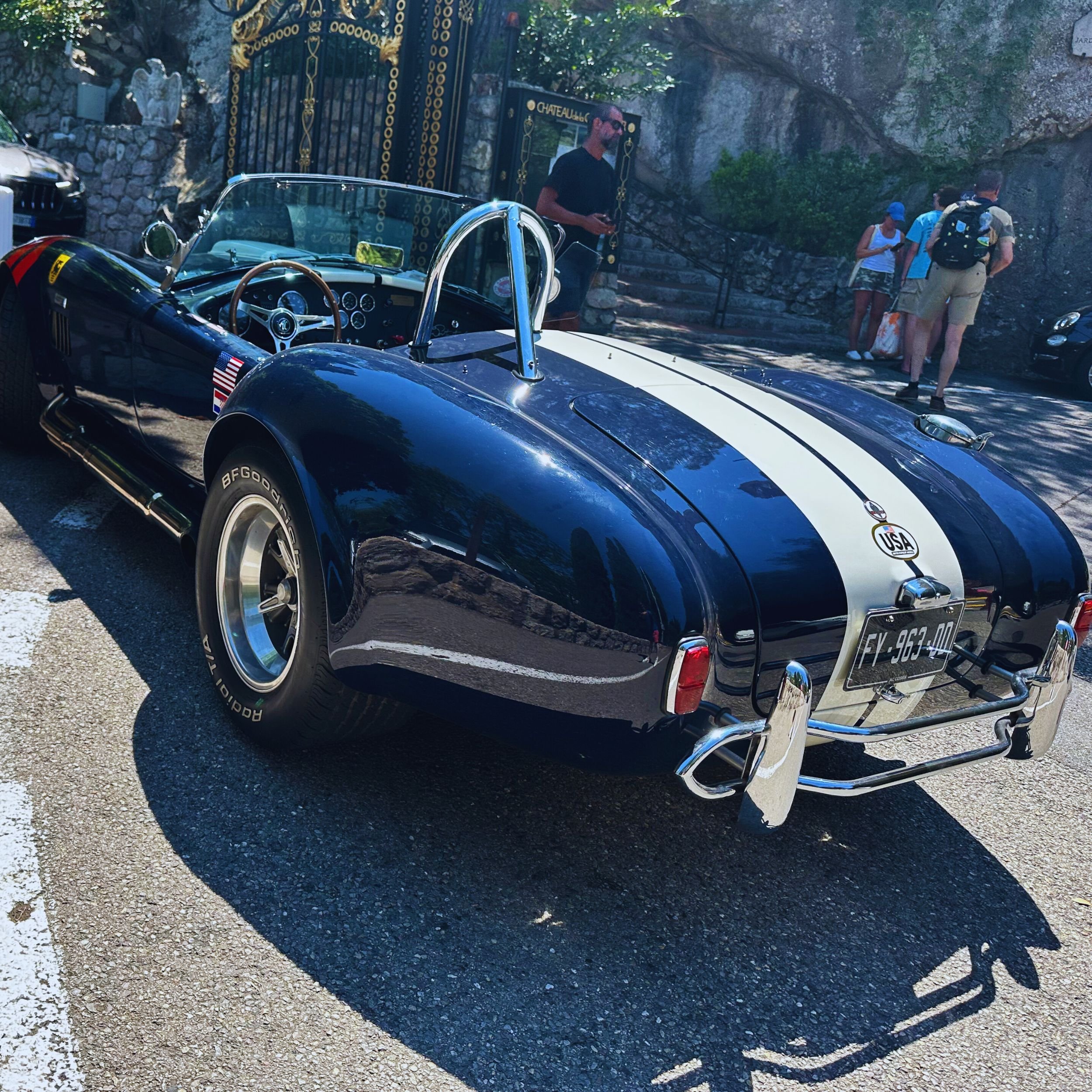 classic sports car arriving at the car park gates of Château de la Chèvre d’Or in Èze