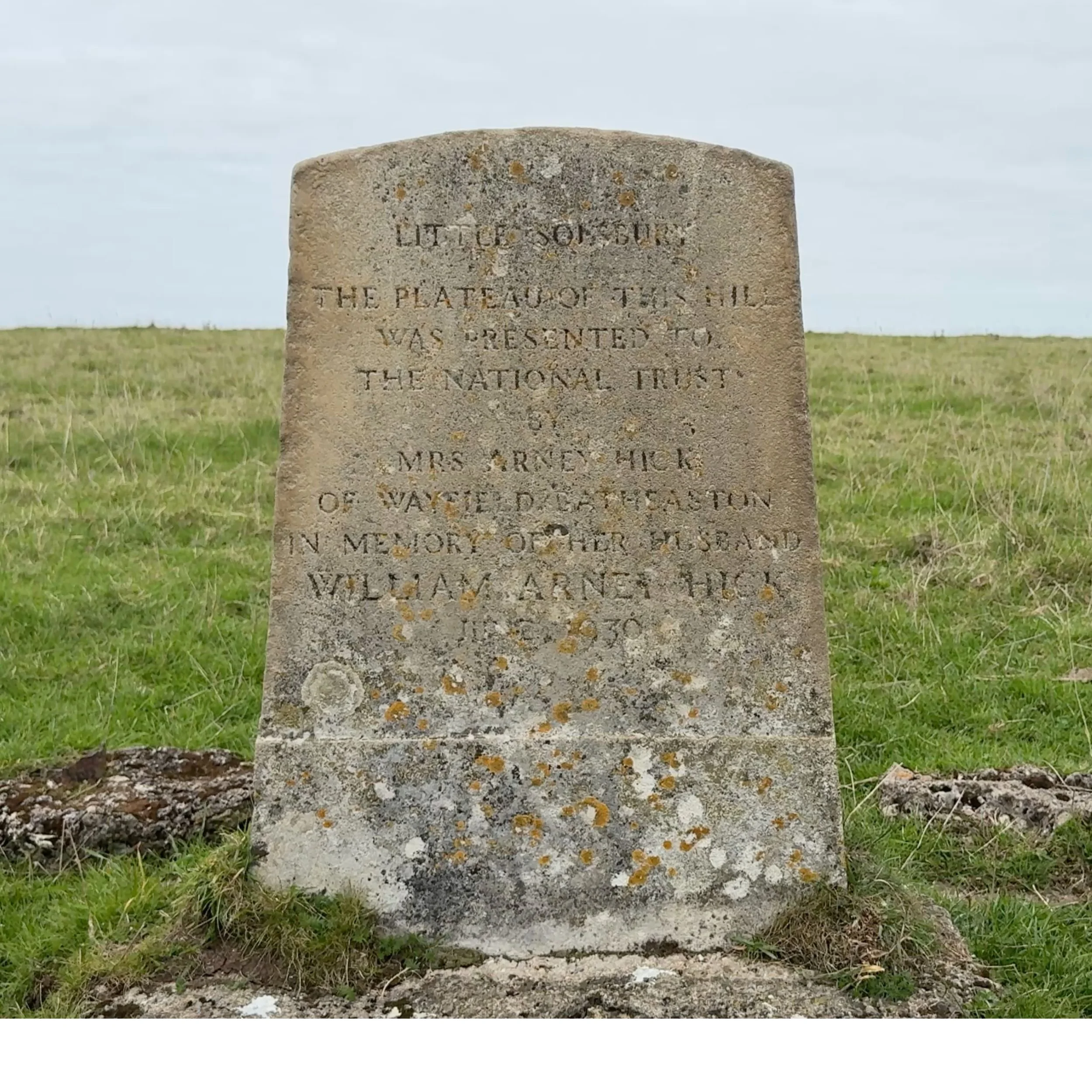 Little Solsbury Hill memorial stone marking the plateau of the hill