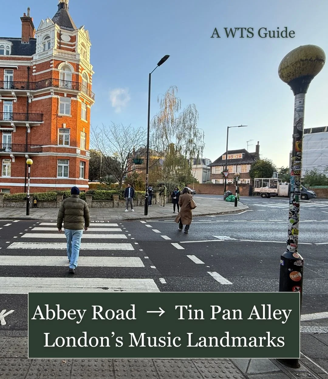 Pedestrians crossing Abbey Road zebra crossing in London on a clear day, the famous Beatles landmark with red brick buildings and street life capturing the everyday setting of music history