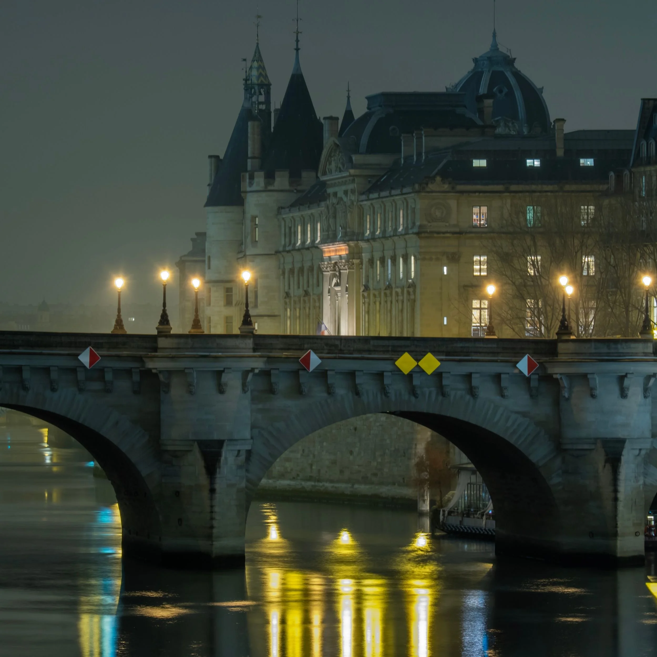 The Pont Neuf at night with the Palais de Justice in the background