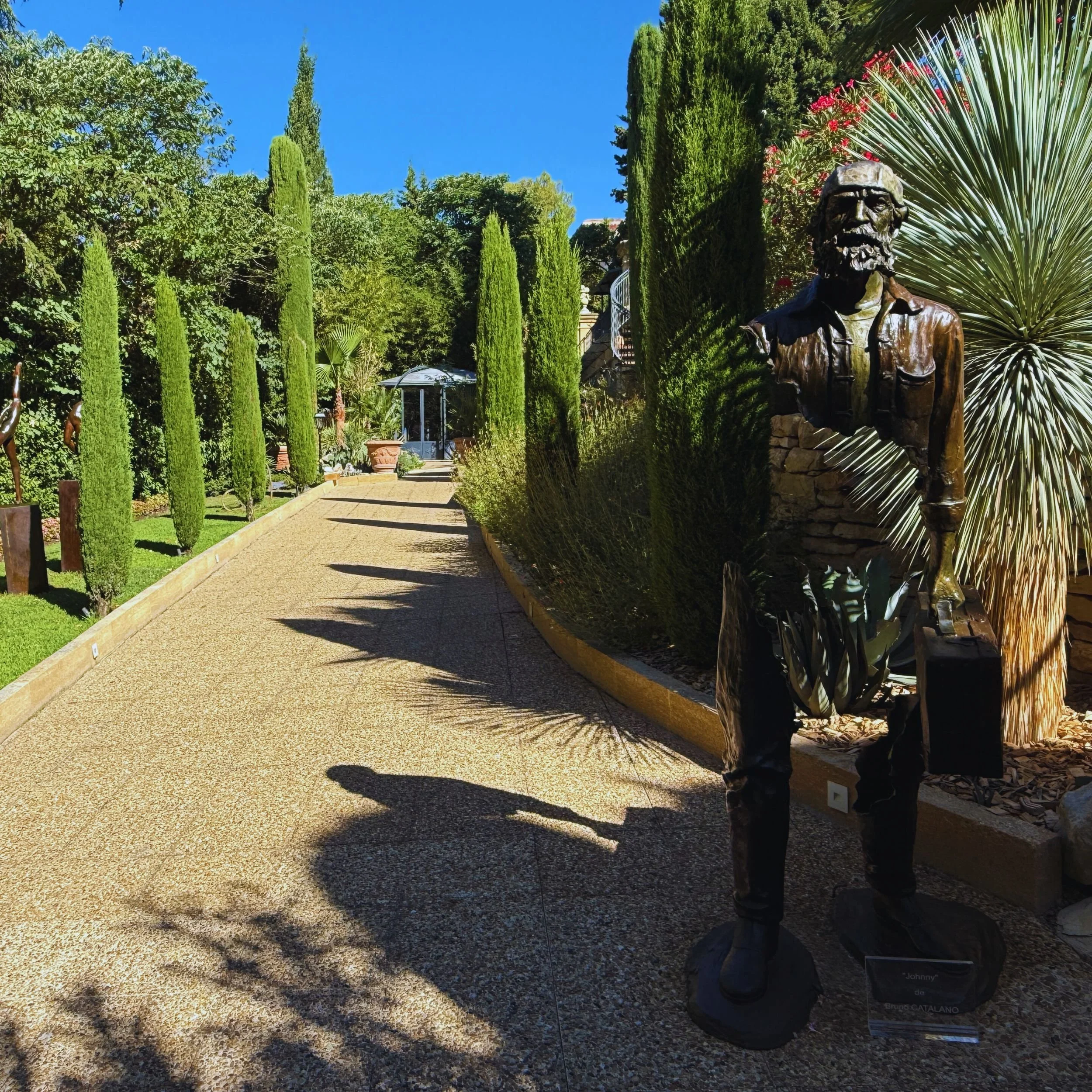 Sculpture-lined garden path at Villa Gallici in Aix-en-Provence