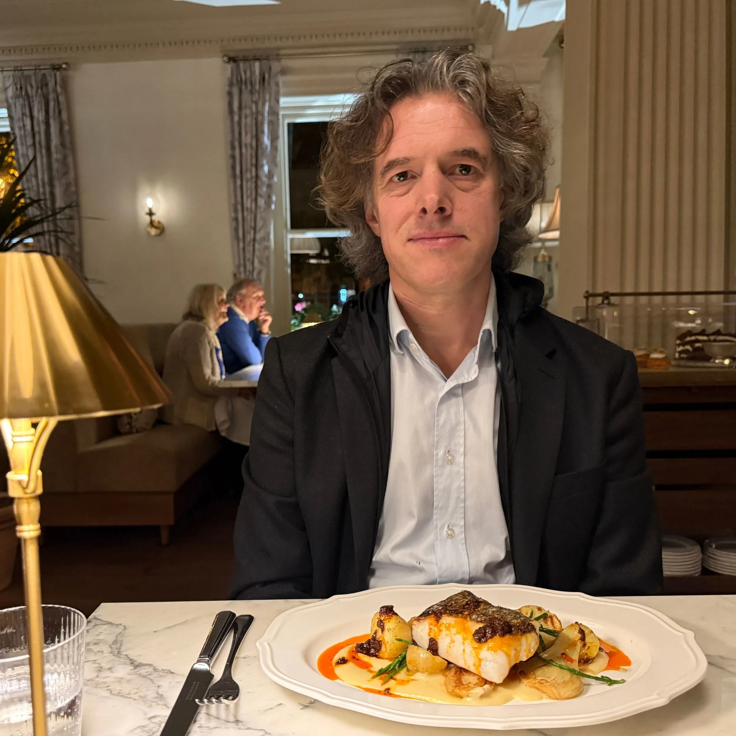 The author with a plate of Hake at Emberwood Bath