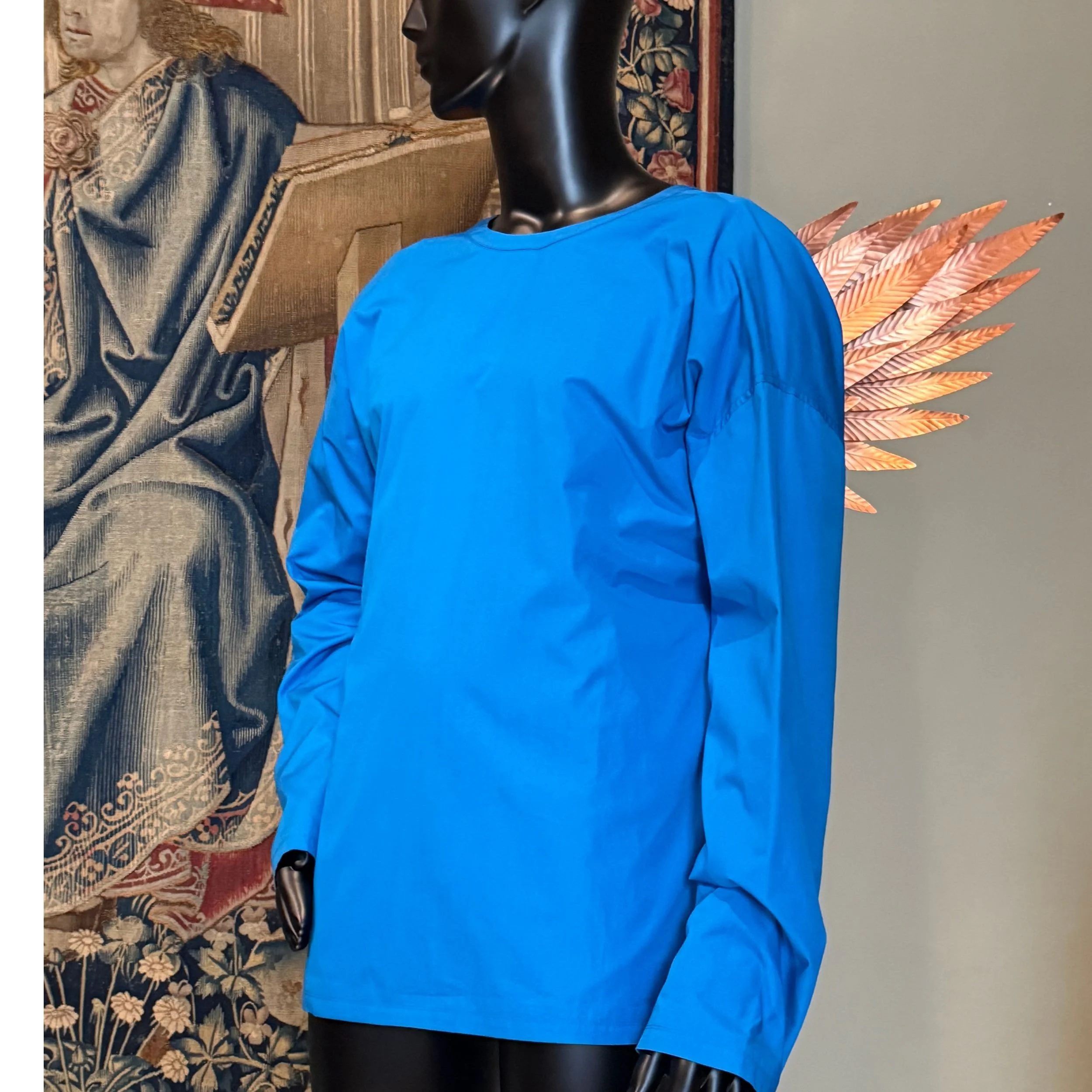 Loewe blue shirt with wings by Jonathan Anderson from 2023–2024 displayed at the Louvre Couture exhibition