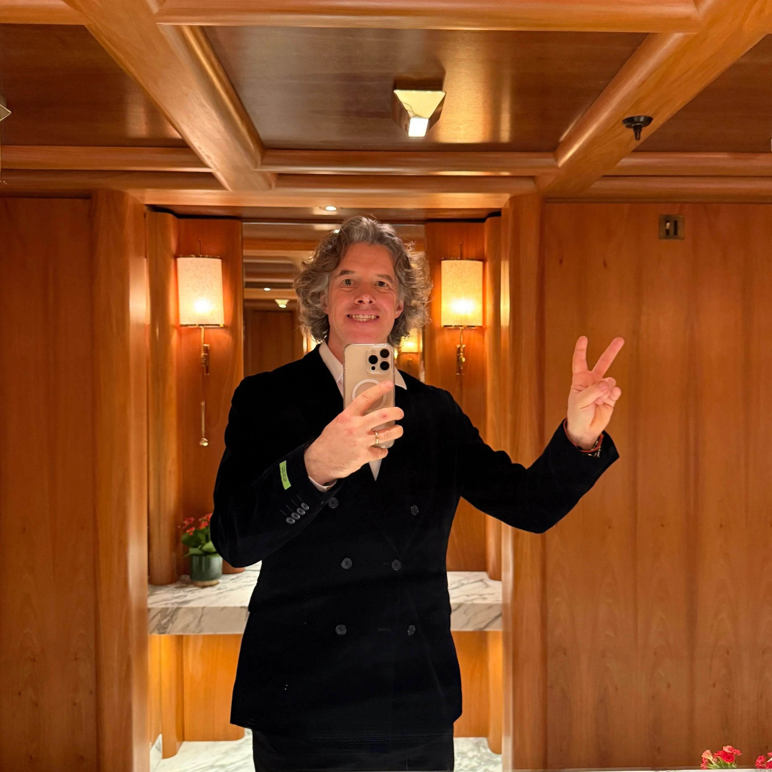 Jamie Riddell taking a mirror selfie at the Chancery Rosewood Hotel in London