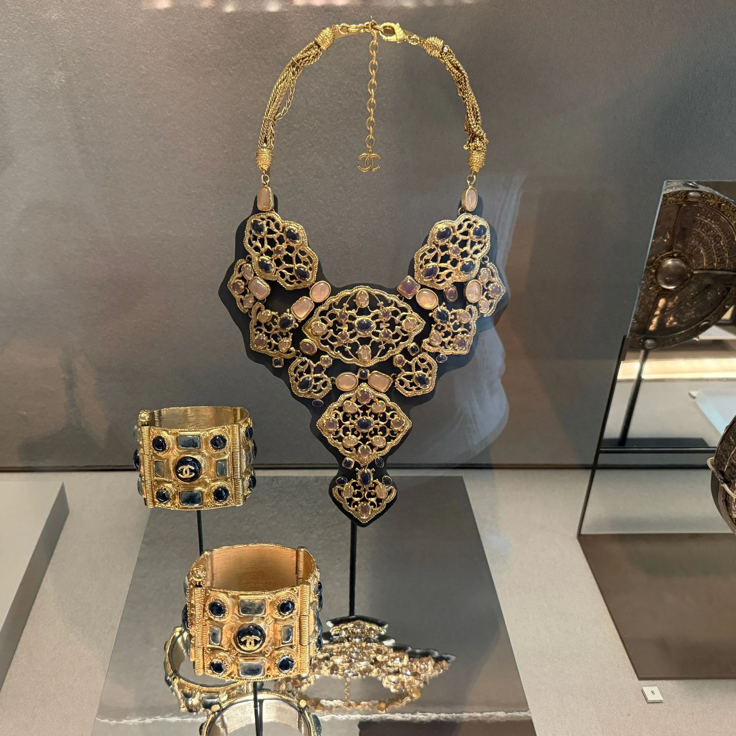 Chanel gilded cuff and necklace by Karl Lagerfeld from the Paris-Byzance collection 2010–2011 displayed at the Louvre Couture exhibition