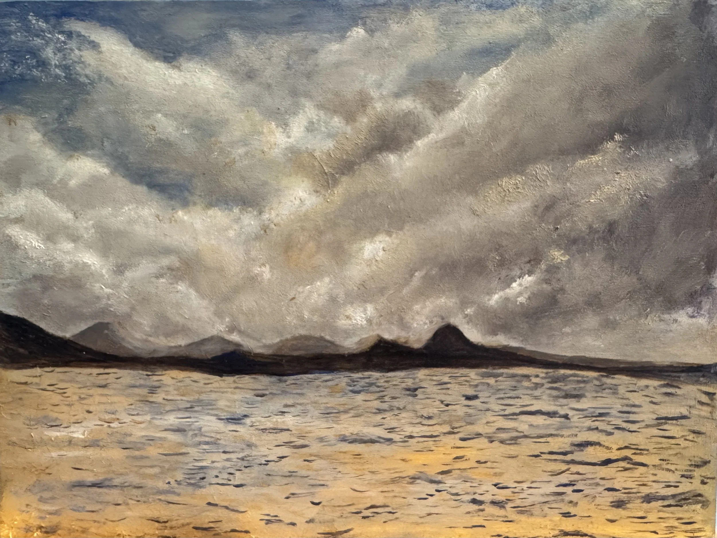 The image shows a close-up view of textured surfaces resembling clouds or geological formations with a range of colors from dark gray to light yellow and brown.