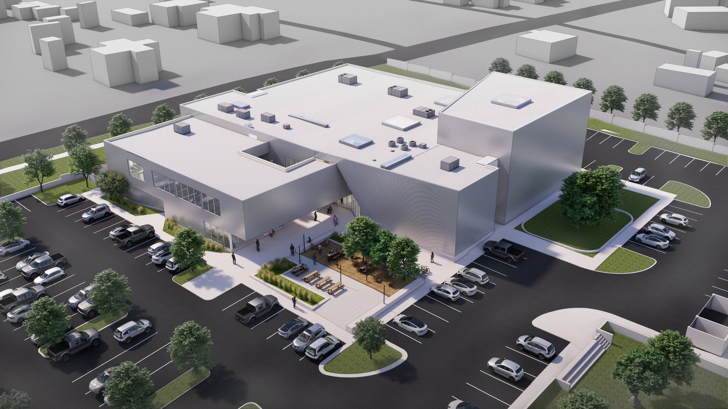 Pulled apart to create a central courtyard, the building invites gathering at its heart—balancing circulation, shade, and community in a single spatial gesture.