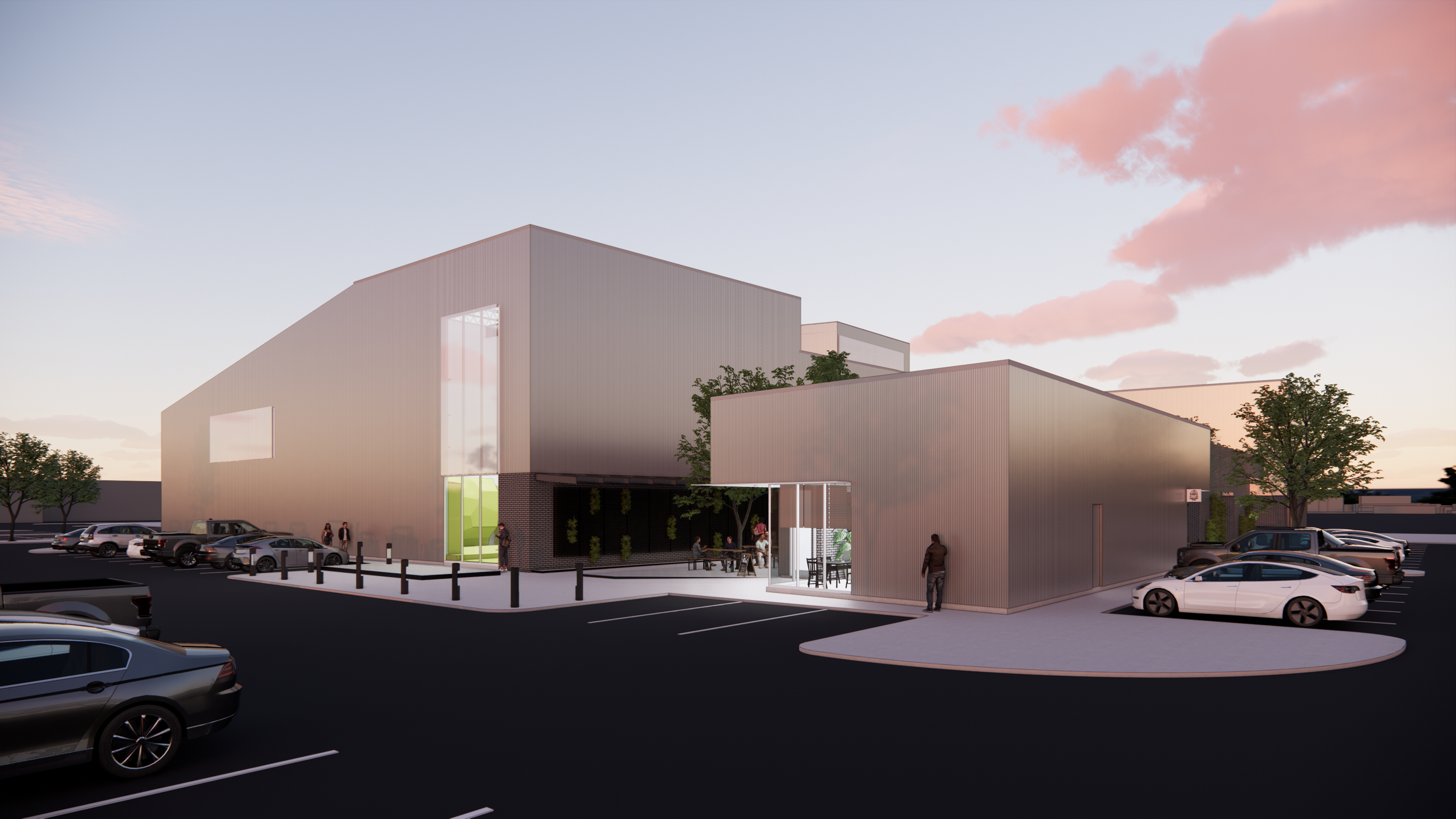 The exterior massing of Crux Pflugerville introduces a monolithic climbing volume softened by warm daylight filtering through translucent panels. A modest entry pavilion offers pedestrian-scale clarity while the angular geometry behind it anchors the